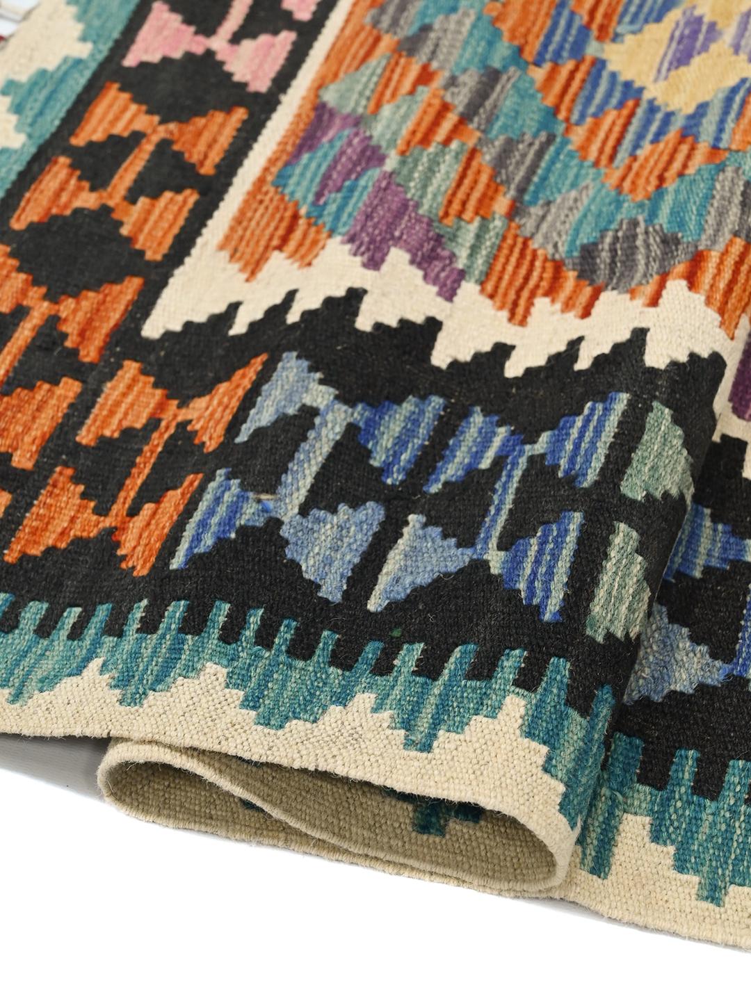 Hand-woven Afghan Kelim rug with geometric patterns in multicolor wool