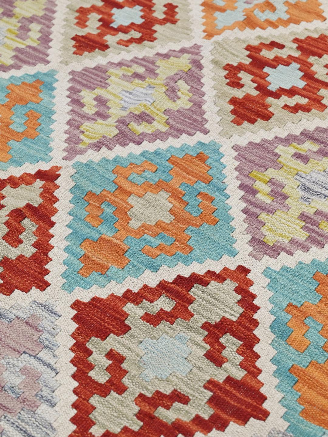Hand-woven rectangular Afghan Kelim rug with vibrant multicolor geometric diamond patterns