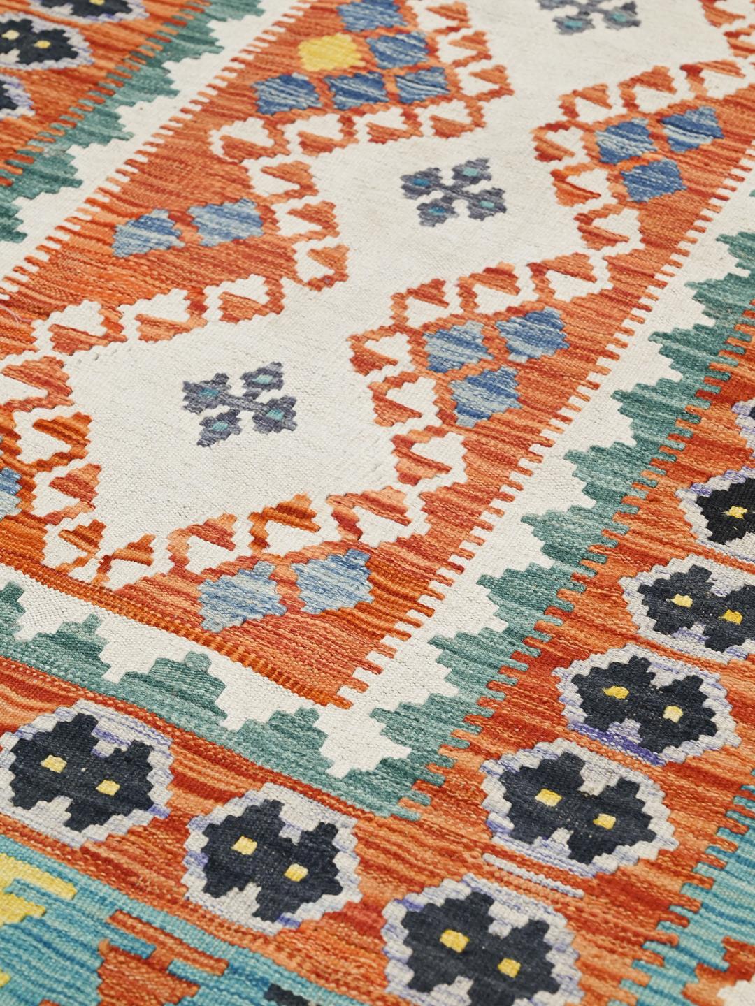 Hand-woven Afghan Kelim rug with vibrant geometric patterns and a multicolor palette