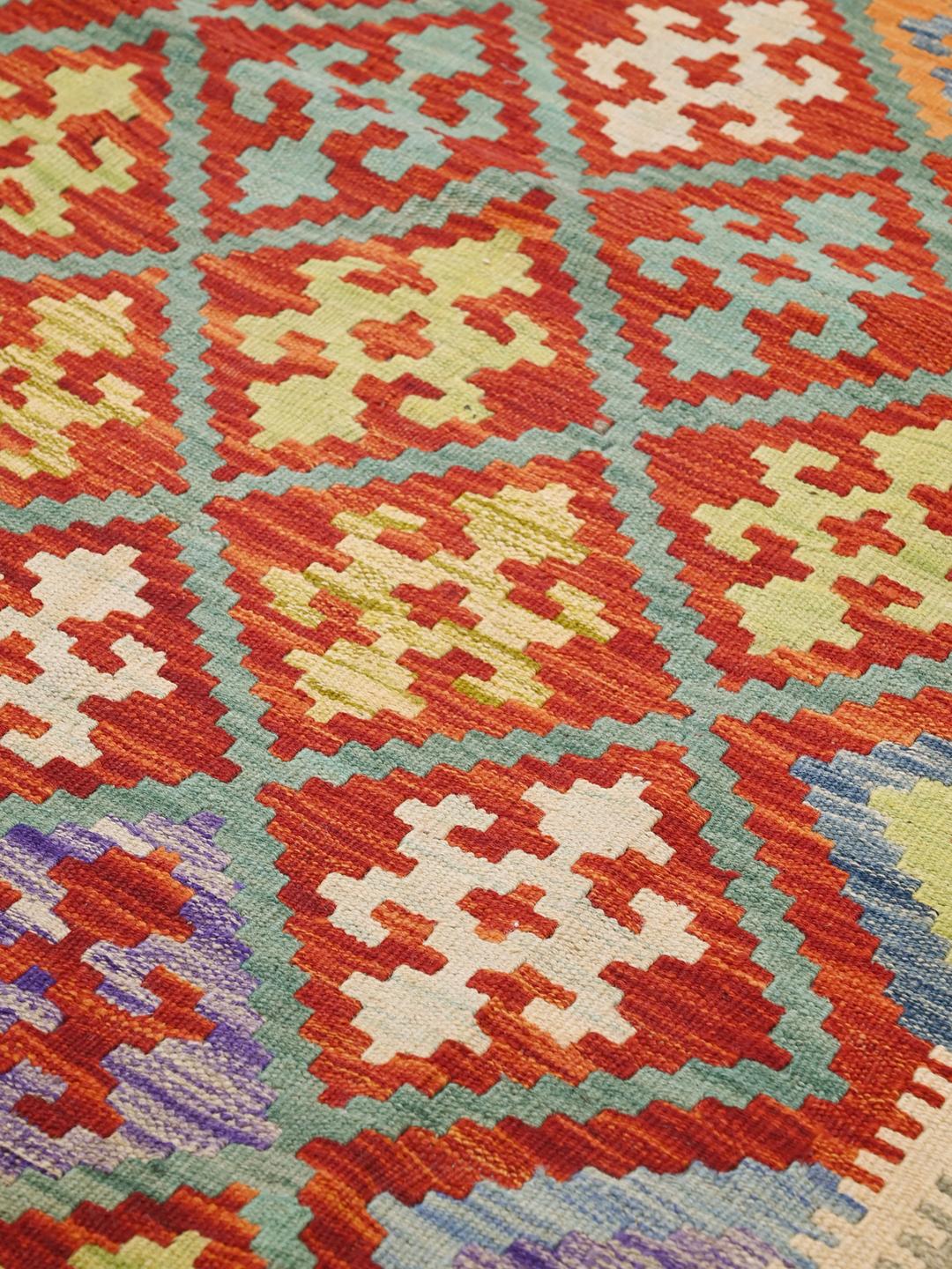 Hand-woven Afghan Kelim wool rug with multicolour geometric diamond patterns
