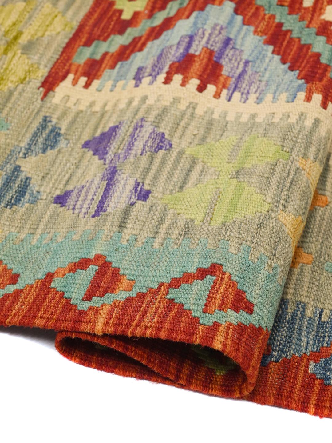 Hand-woven Afghan Kelim wool rug with multicolour geometric diamond patterns