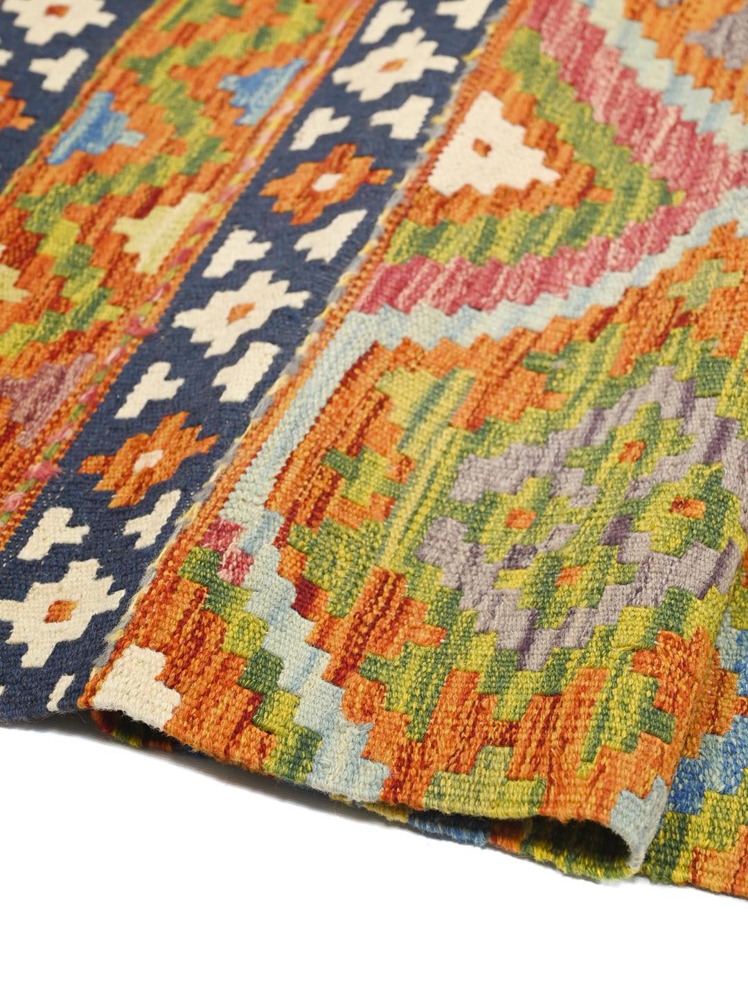 Hand-woven Afghan Kelim rug featuring vibrant geometric patterns in multicolor Wool