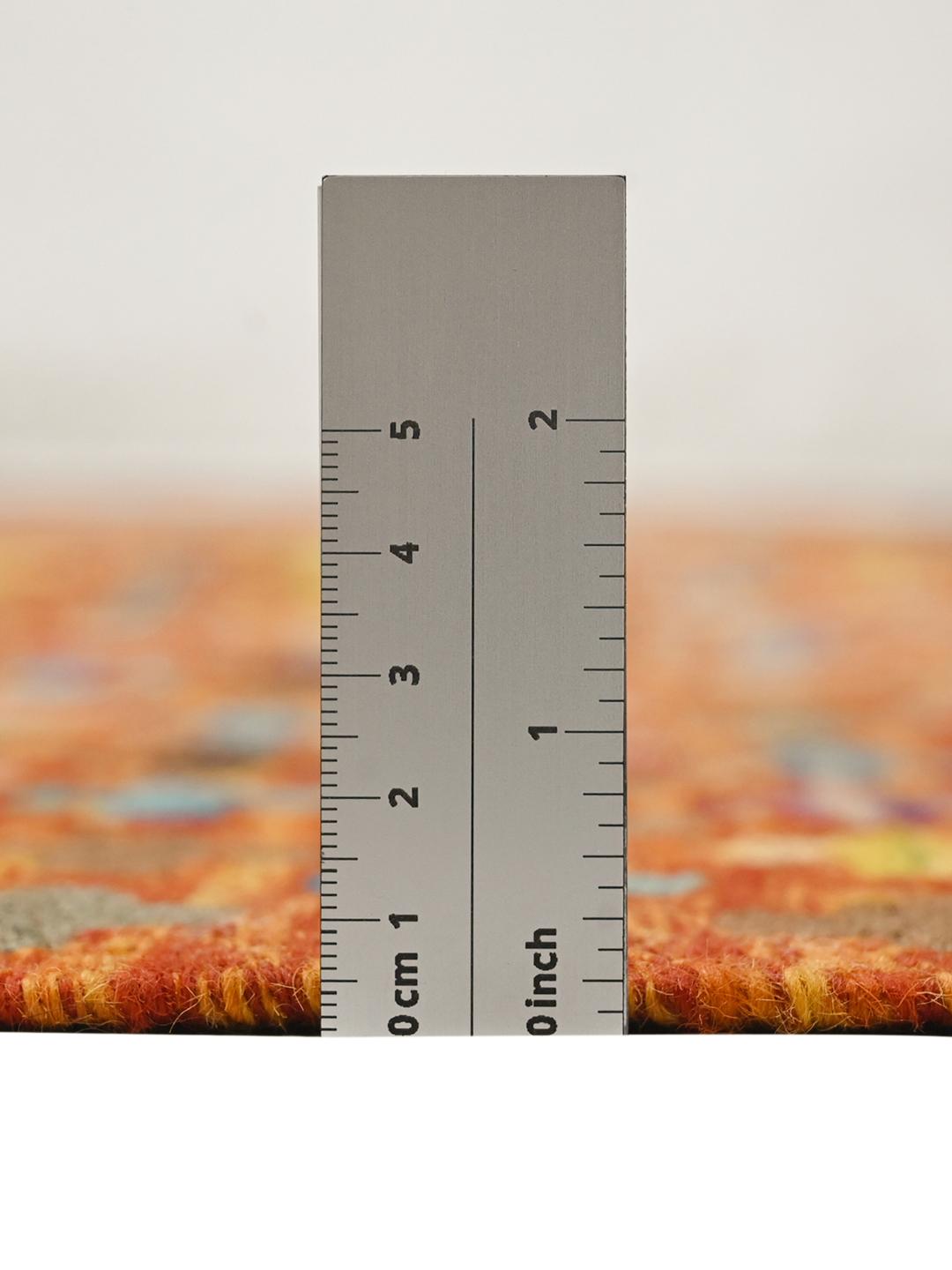 A hand-woven Afghan Kelim rug featuring a vibrant orange field with multi-coloured geometric crosses.