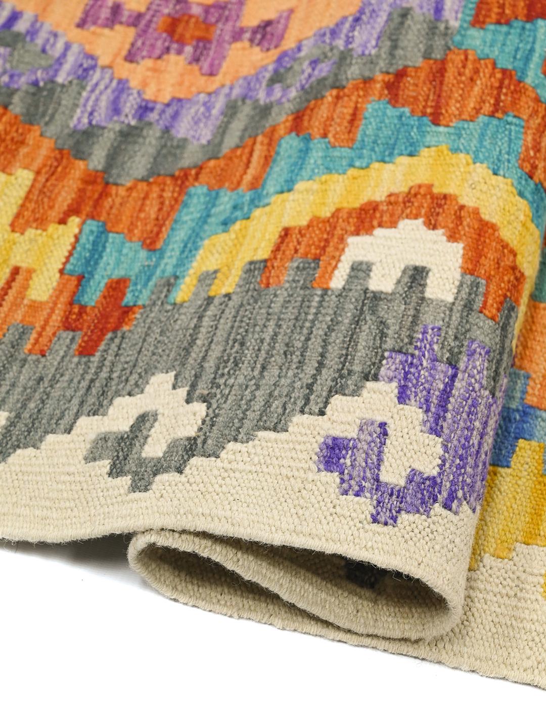 Hand-woven Afghan Kelim rug with vibrant multicolor diamond patterns