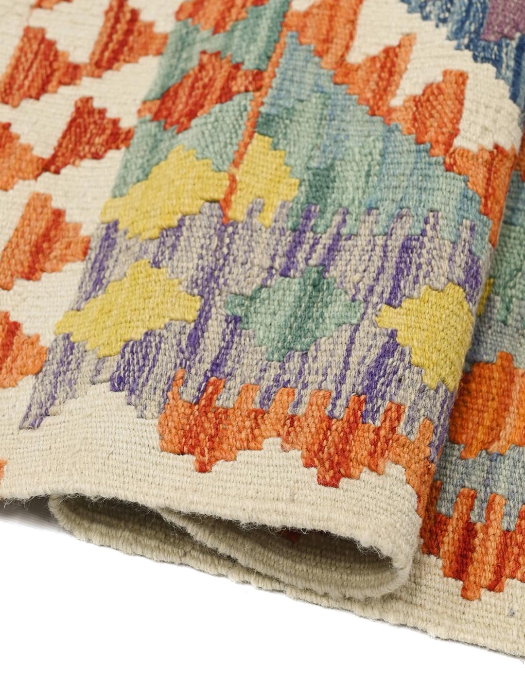 Hand-woven Kelim Afghan rug in multicolor wool with tribal diamond patterns