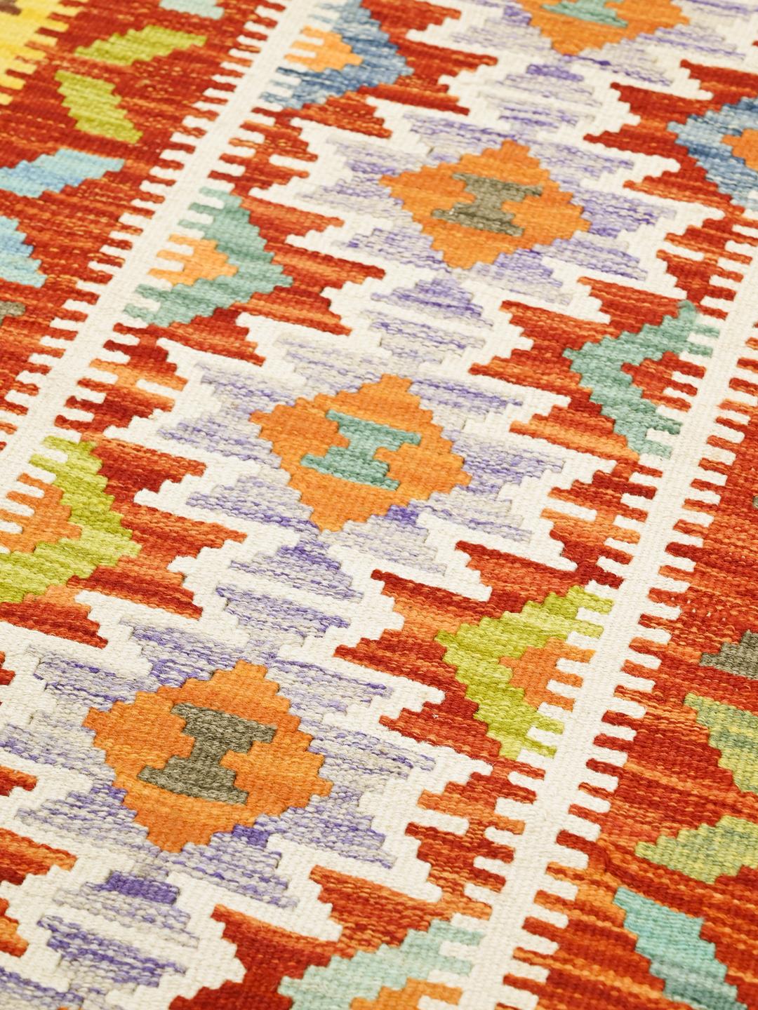 Hand-woven red Kelim Afghan Old Style runner rug with geometric patterns