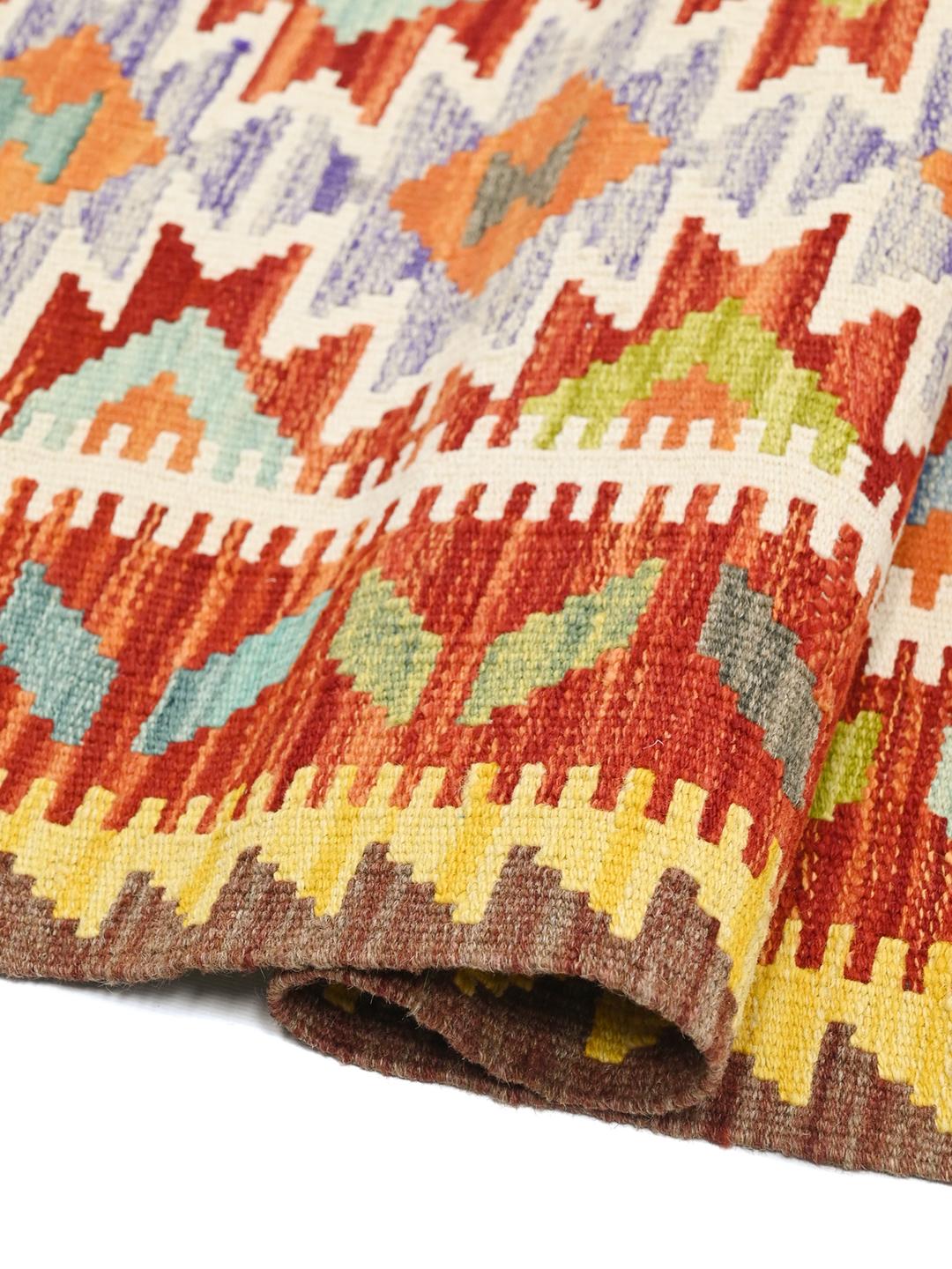 Hand-woven red Kelim Afghan Old Style runner rug with geometric patterns