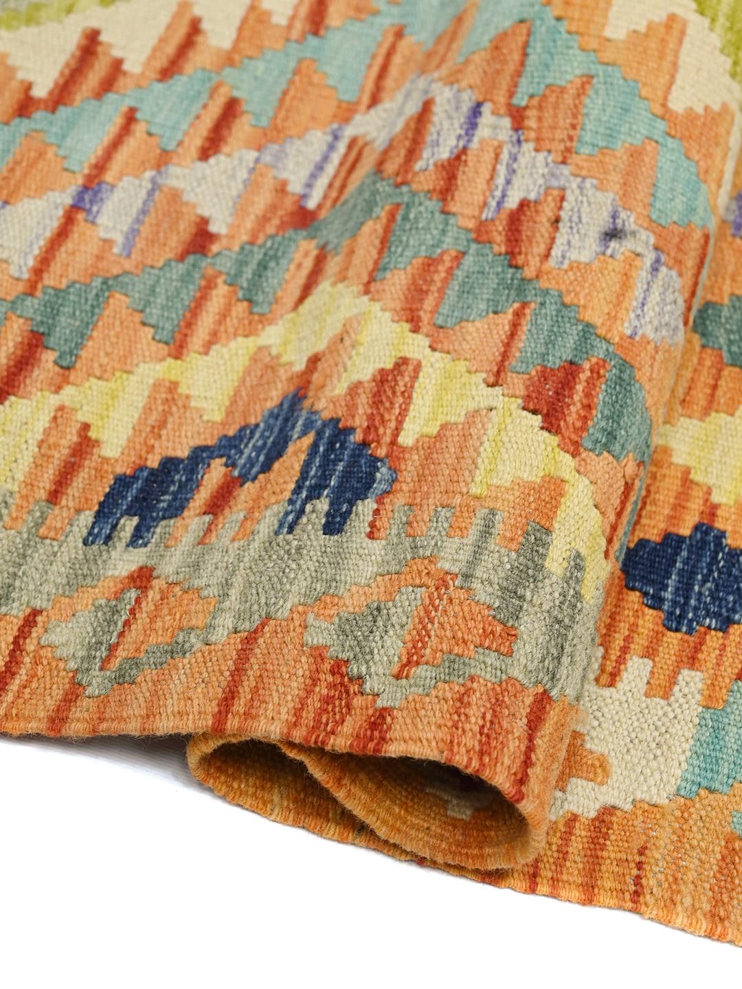 Hand-woven Afghan Kelim runner with geometric patterns in multicolour