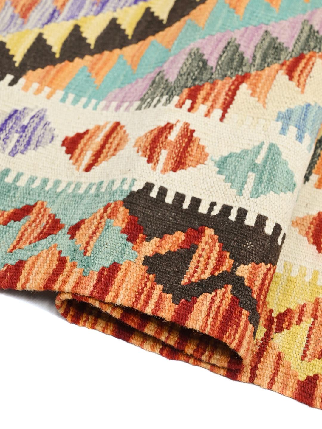 Hand-woven Afghan runner featuring bold geometric patterns in multicolor Wool.