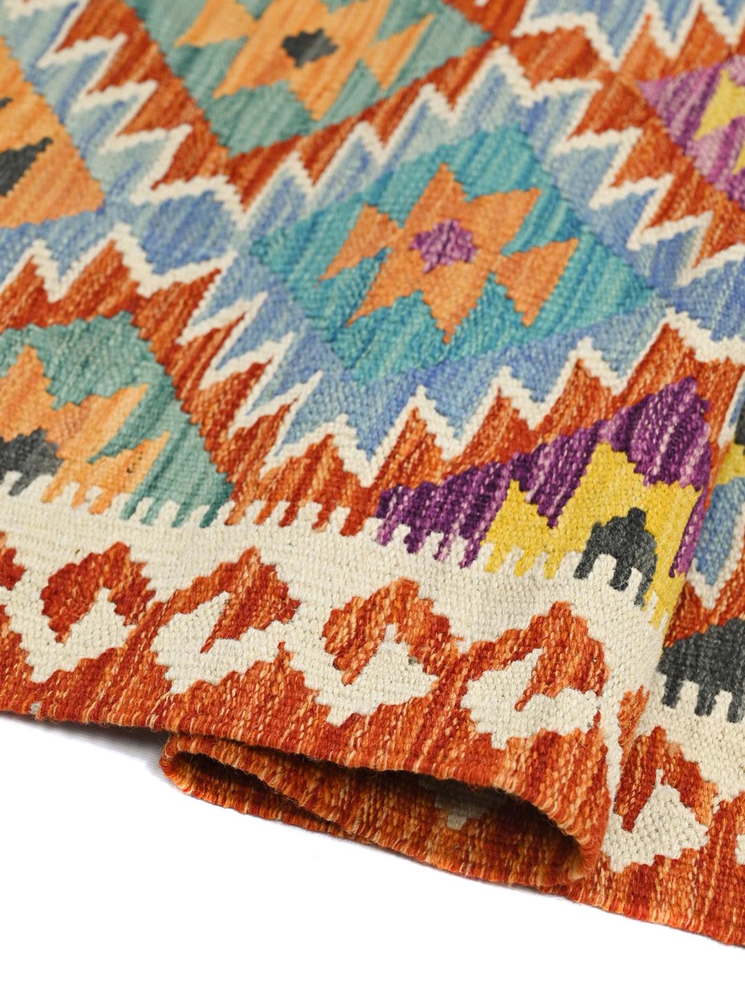 Hand-woven Afghan runner with vibrant geometric patterns in multicolor wool