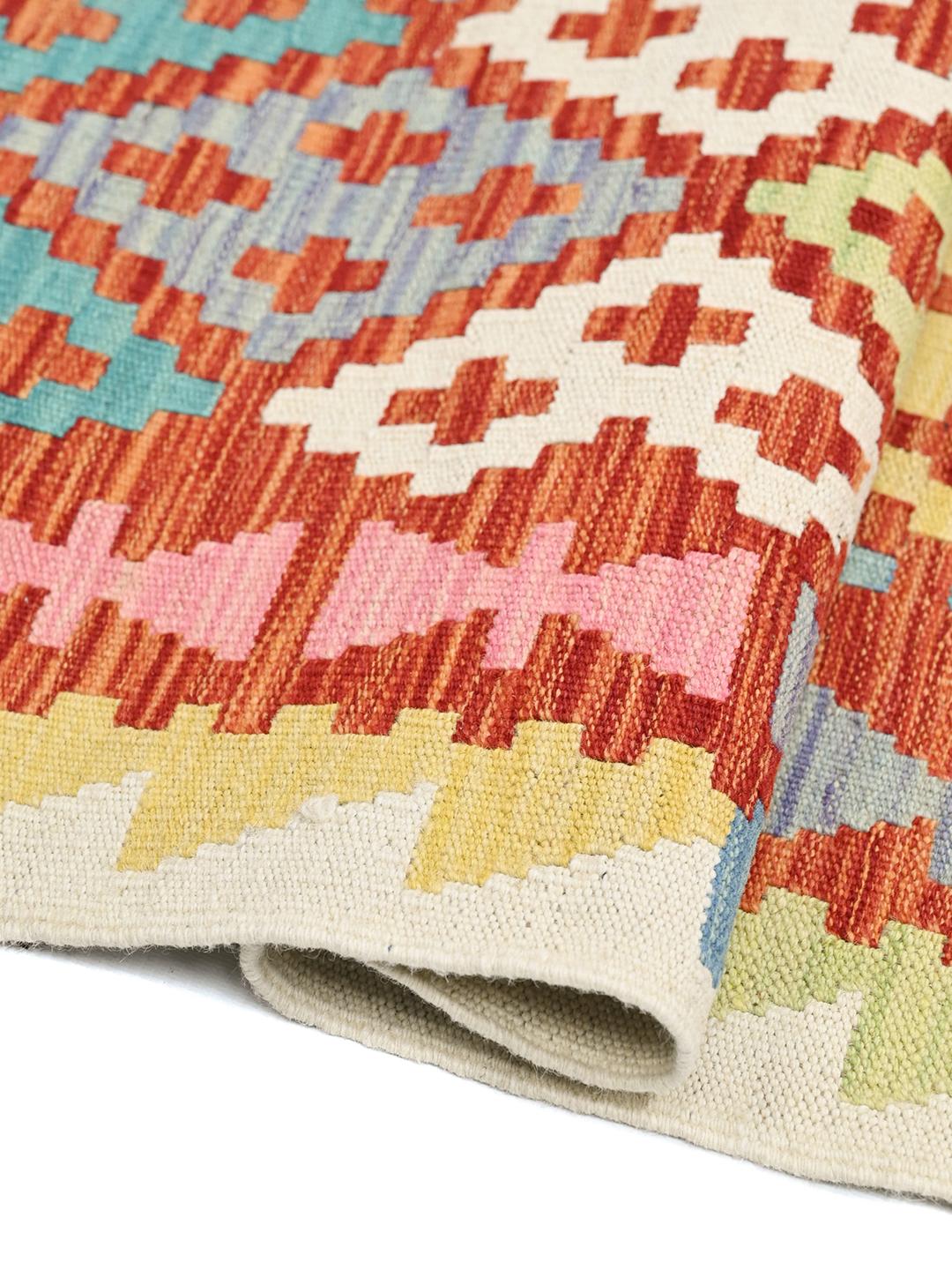 Hand-woven Afghan runner with a vibrant geometric pattern in multicolor wool
