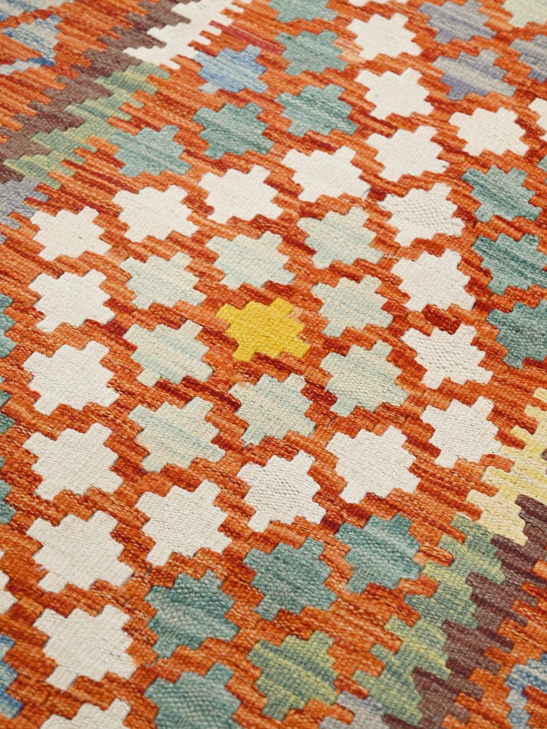 Hand-woven Afghan runner with a geometric diamond pattern in red, blue, and yellow Wool.