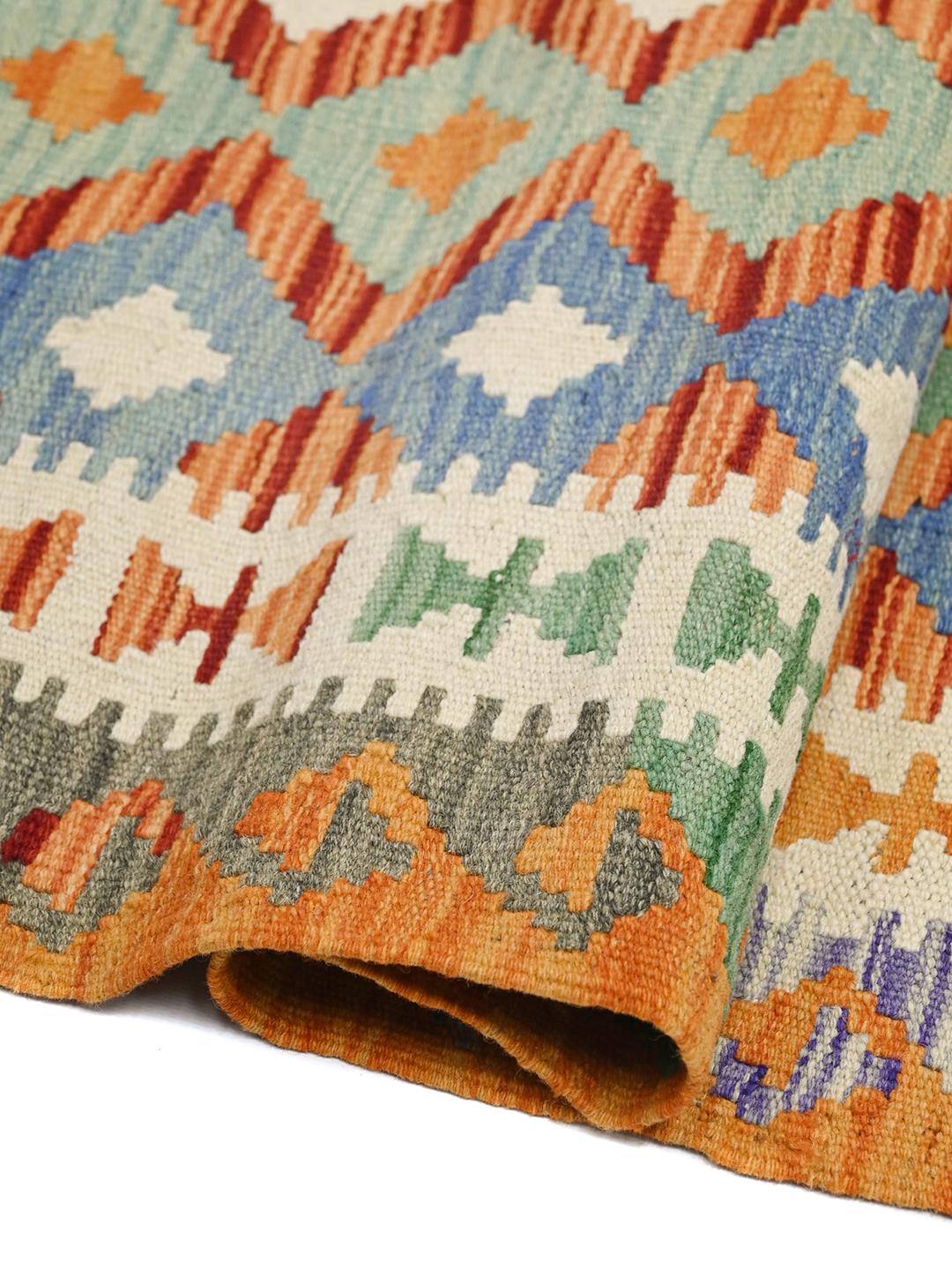 Hand-woven Afghan runner with vibrant multicolored diamond patterns