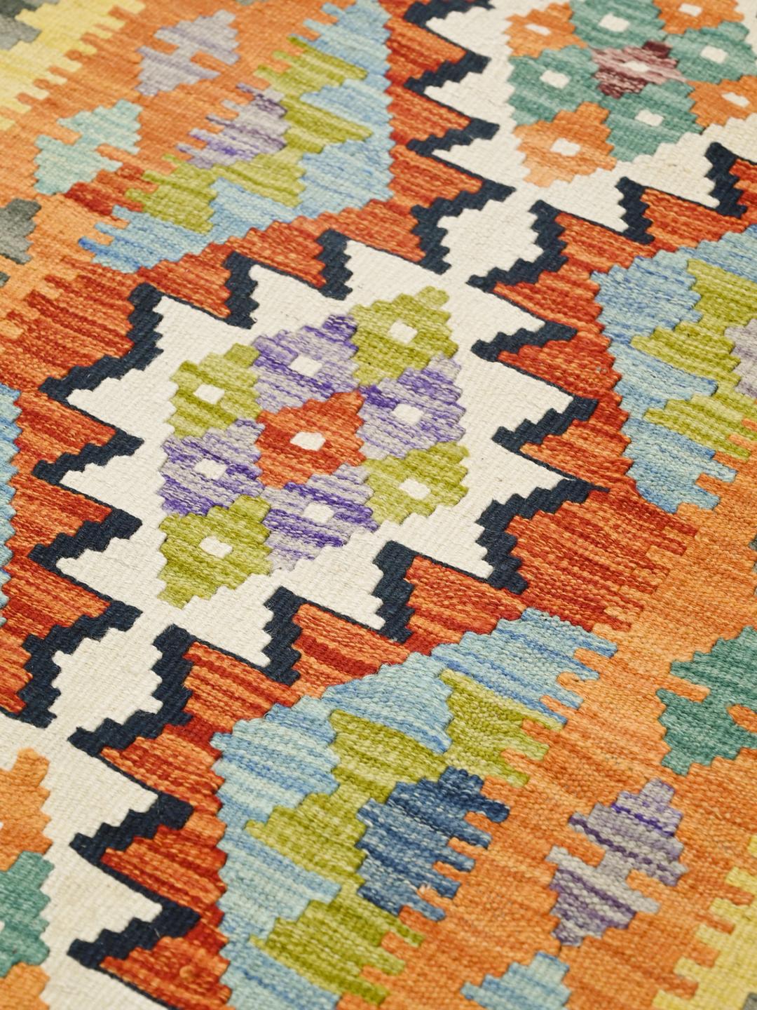 Hand-woven Afghan runner with colourful geometric patterns in multicolour wool