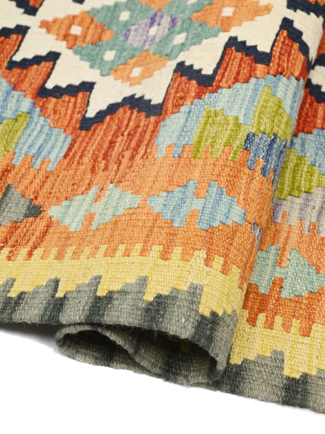 Hand-woven Afghan runner with colourful geometric patterns in multicolour wool