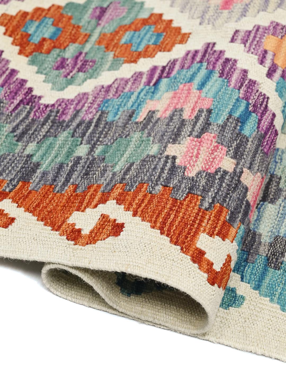 Hand-woven Afghan runner rug with a multicolor geometric diamond pattern