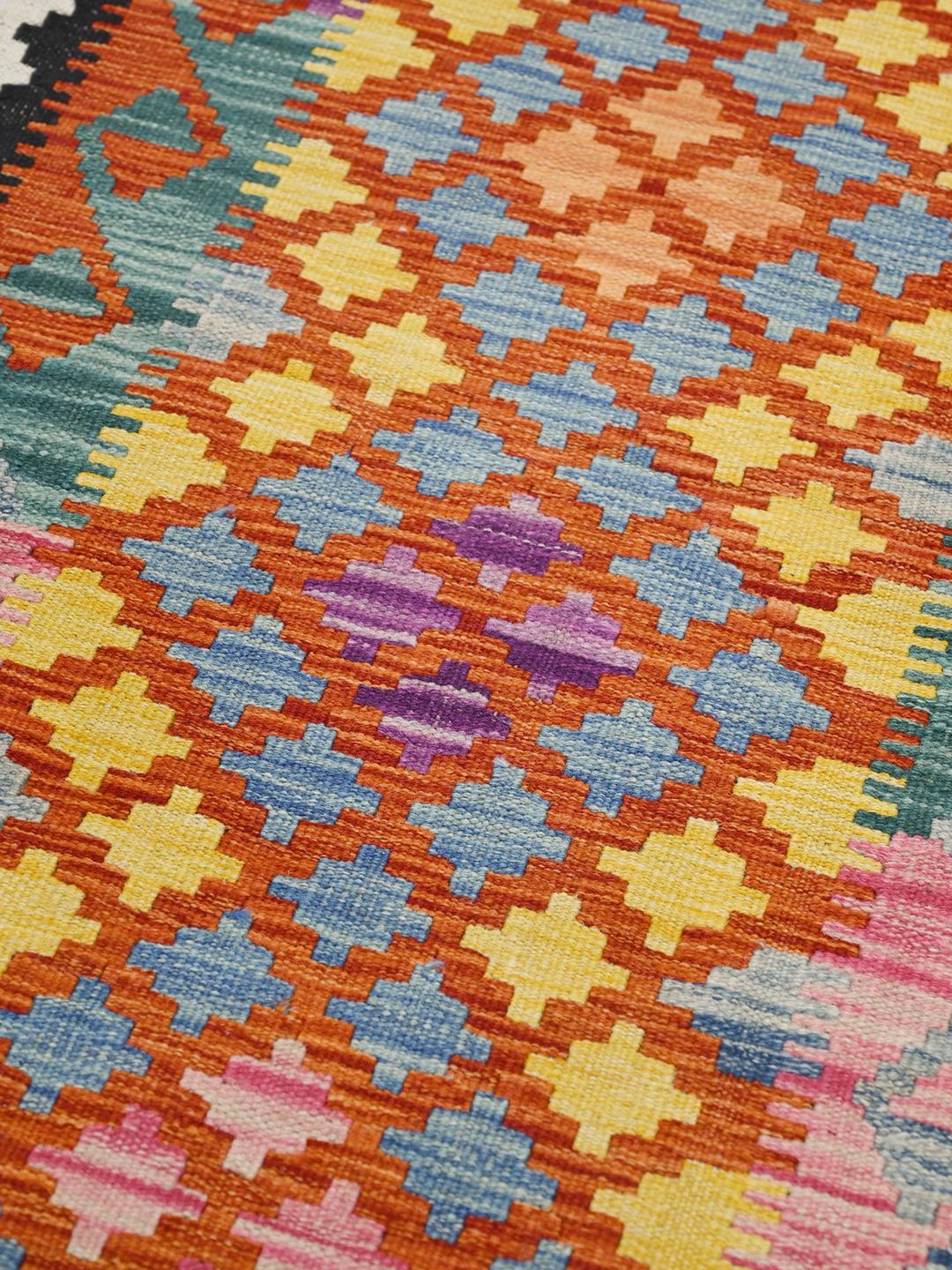 Hand-woven Afghan runner with a vibrant geometric pattern in multicolor Wool