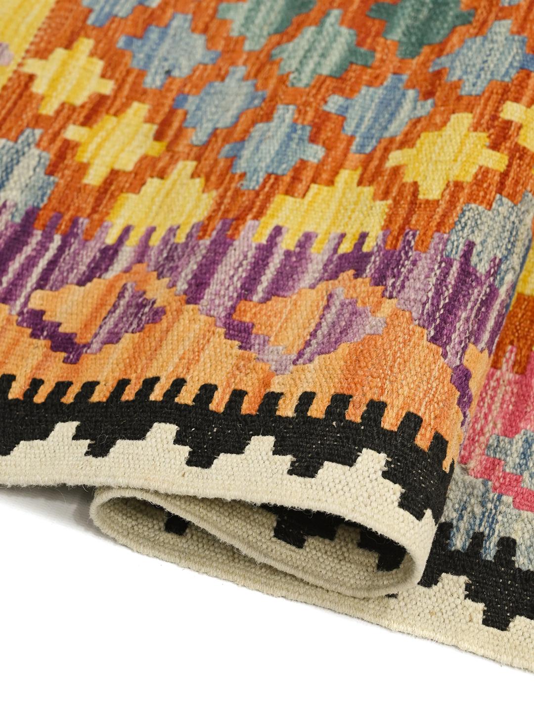 Hand-woven Afghan runner with a vibrant geometric pattern in multicolor Wool