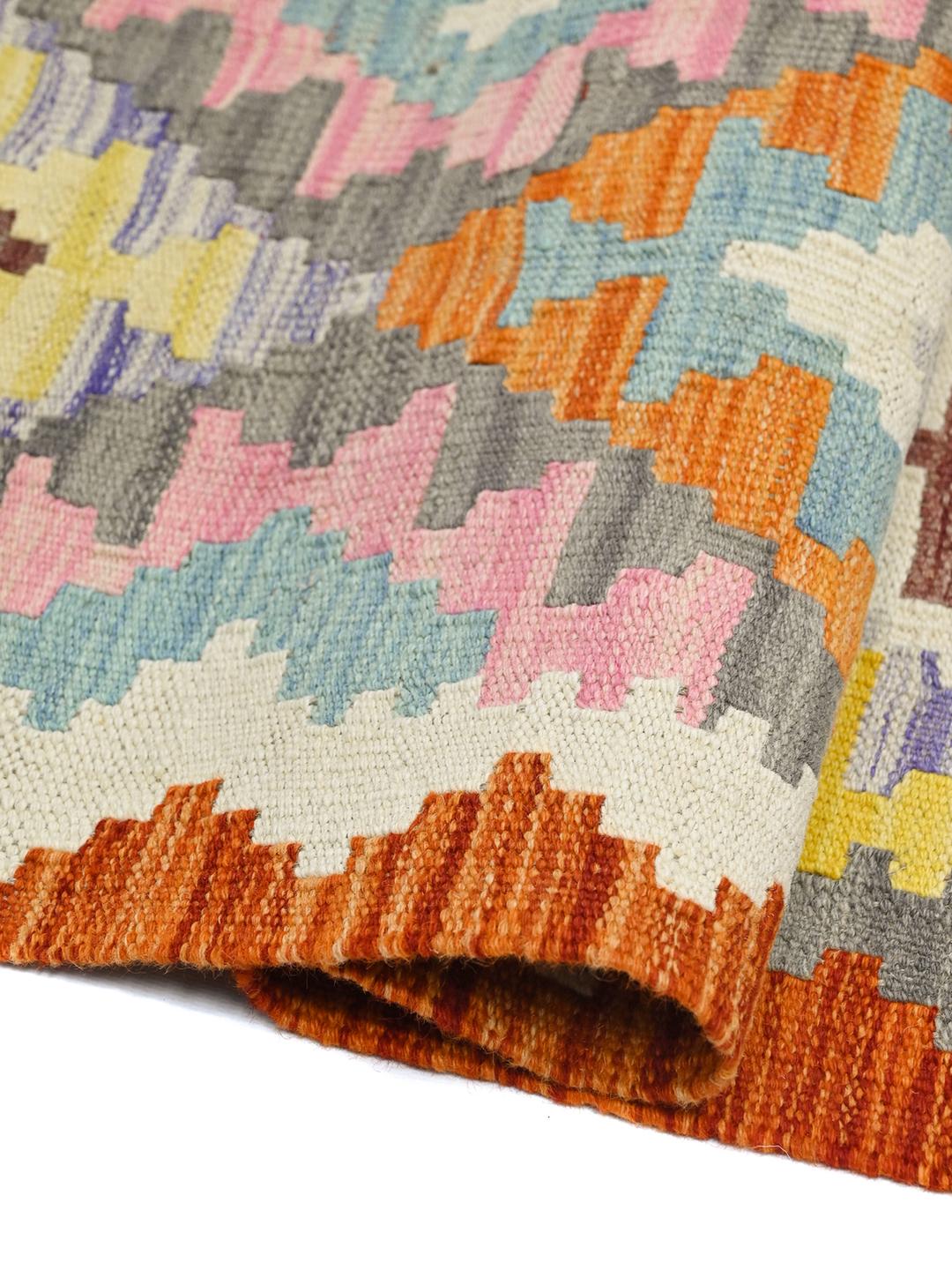 Hand-woven Afghan runner rug with vibrant geometric patterns in multicoloured Wool