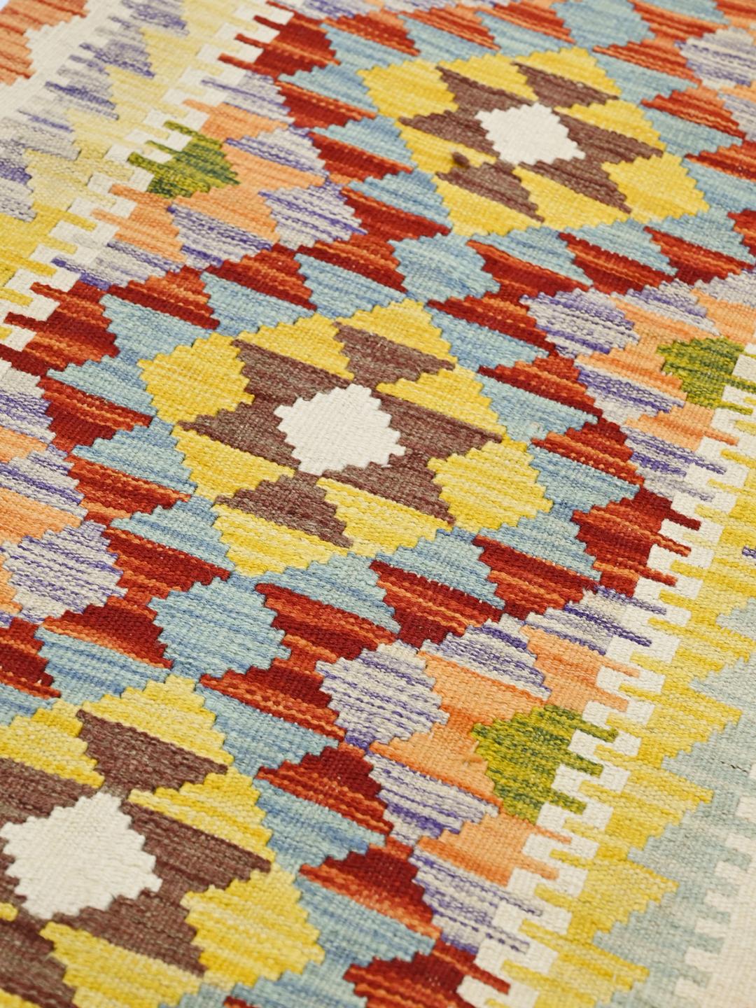Hand-woven Afghan runner with vibrant geometric patterns in multicolor Wool