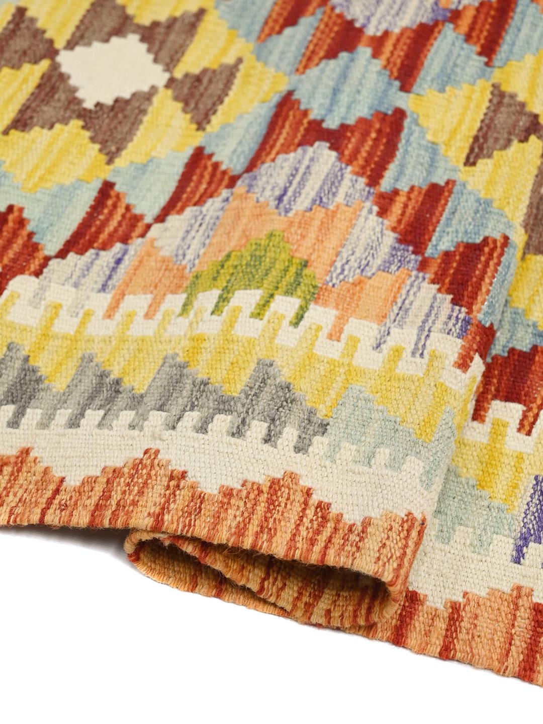 Hand-woven Afghan runner with vibrant geometric patterns in multicolor Wool