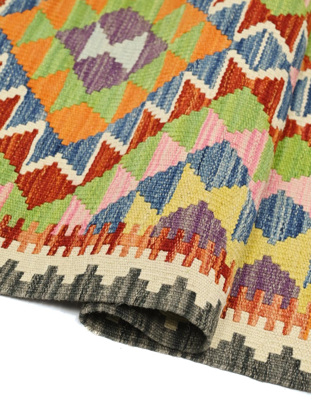 Hand-woven Afghan runner featuring vibrant geometric patterns in multicolor wool