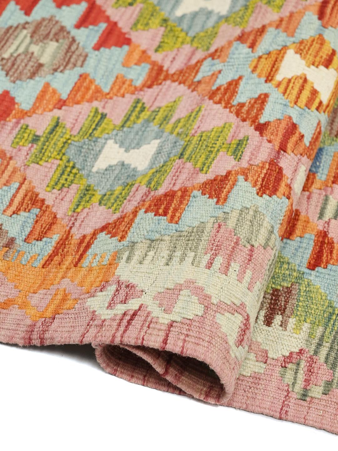 Hand-woven Afghan runner with a vibrant geometric diamond pattern in multicolor wool