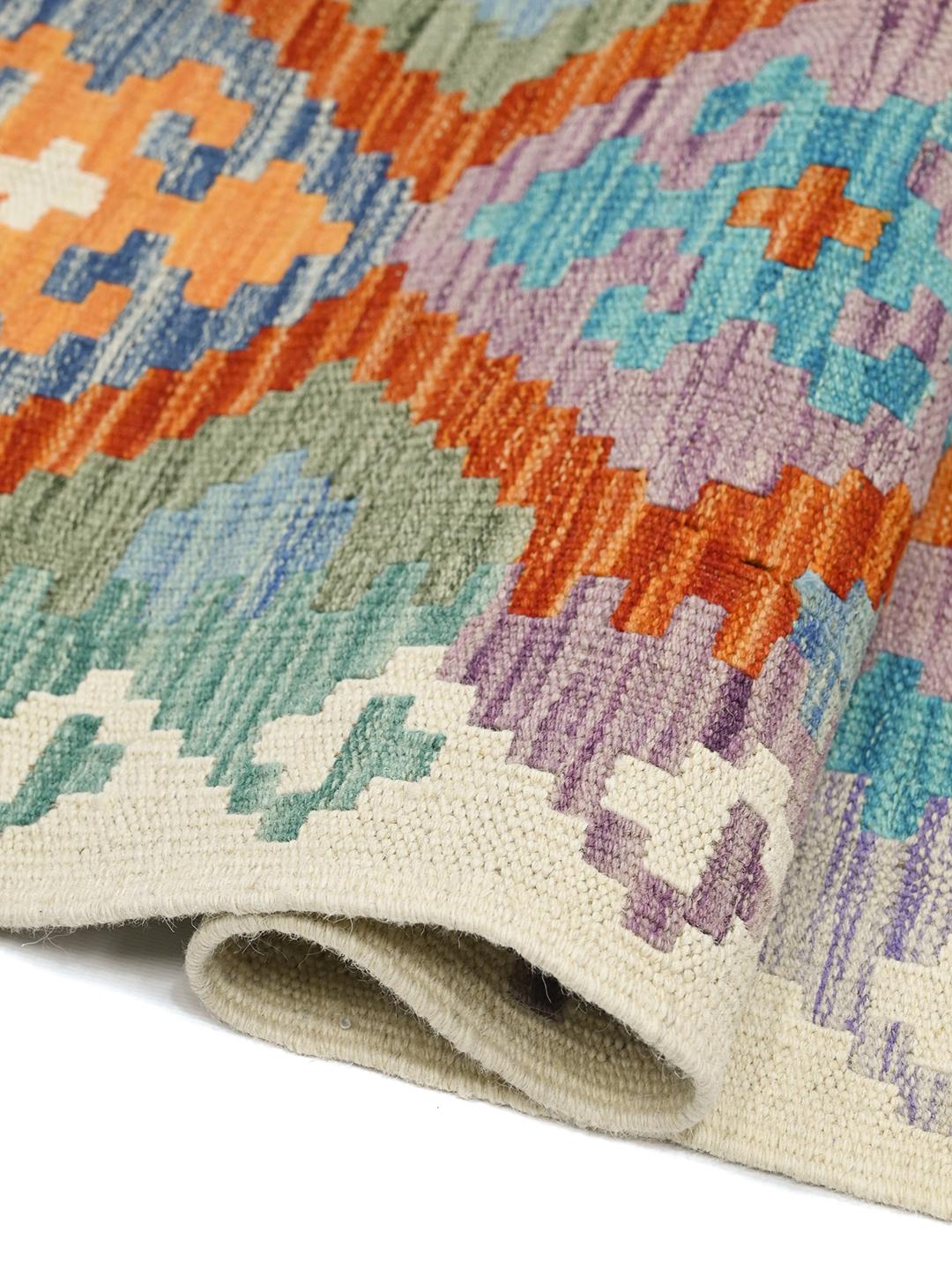 Hand-woven Afghan runner with colourful geometric diamond patterns