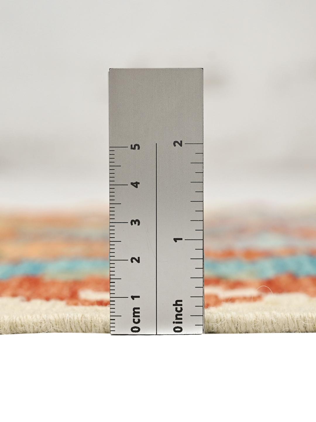 Hand-woven Afghan runner with colourful geometric diamond patterns