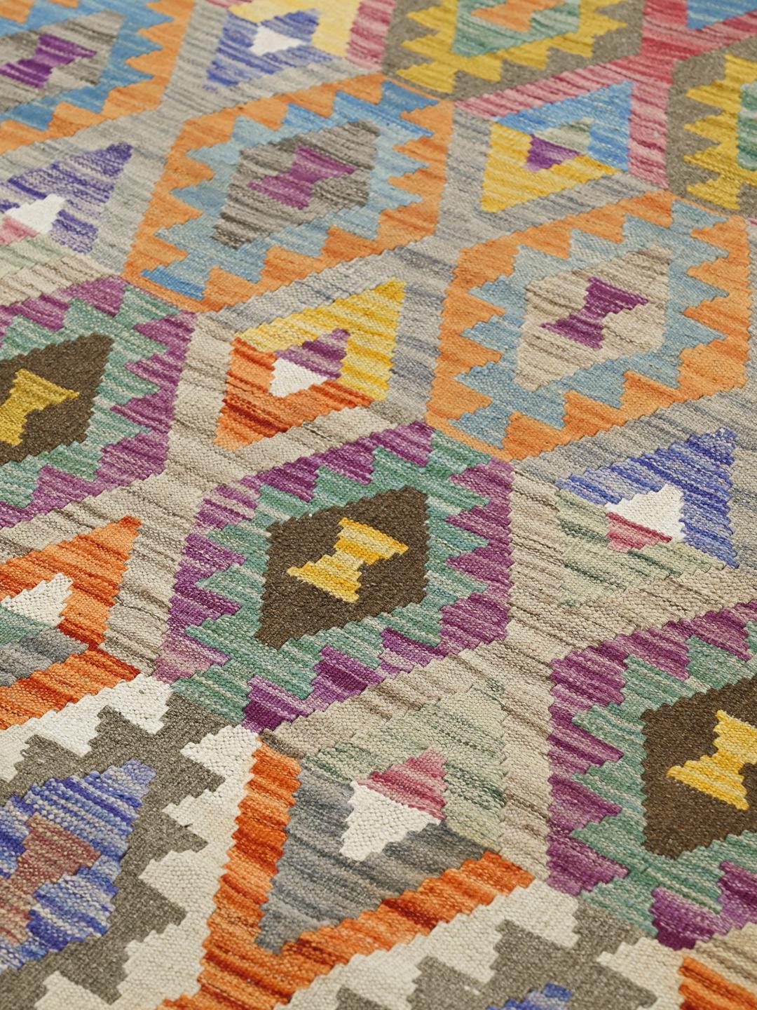 Hand-woven Afghan Kelim rug featuring geometric patterns in multicolour wool