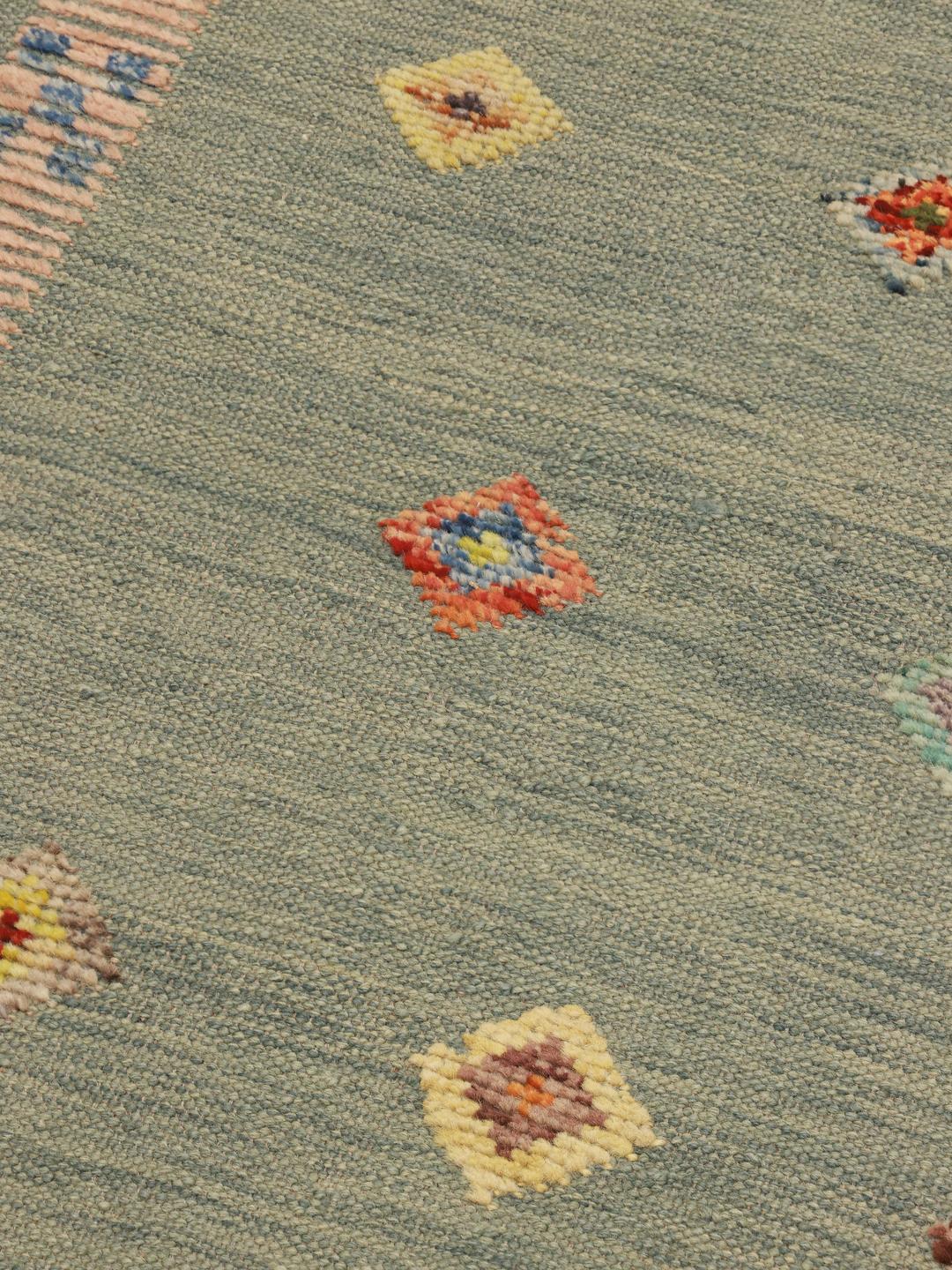 Hand-woven Afghan Kilim rug with a blue-green field and colourful diamond motifs