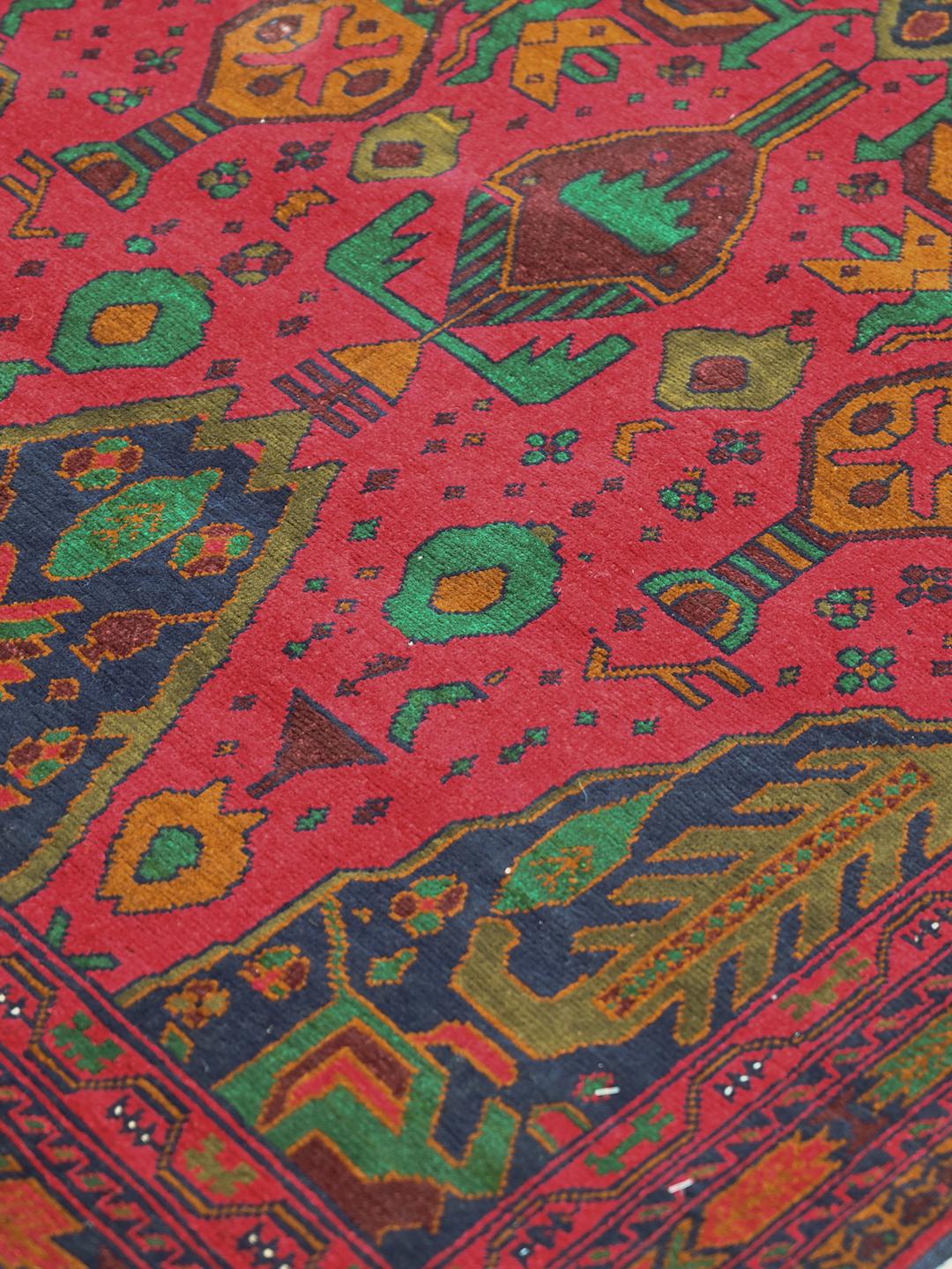 Hand-knotted Afghan runner rug in red and dark-blue wool