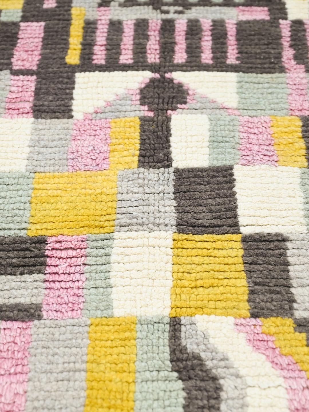 Hand-knotted multicolor wool rug from Afghanistan with vibrant geometric patterns