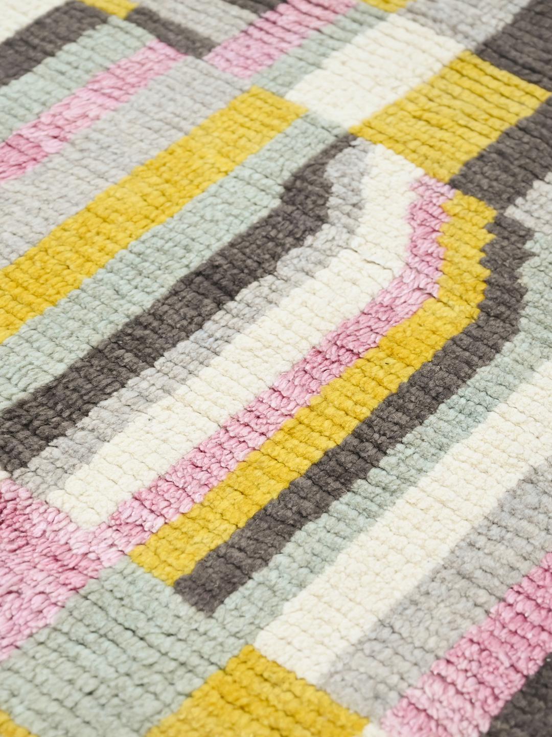 Hand-knotted multicolor wool rug from Afghanistan with vibrant geometric patterns
