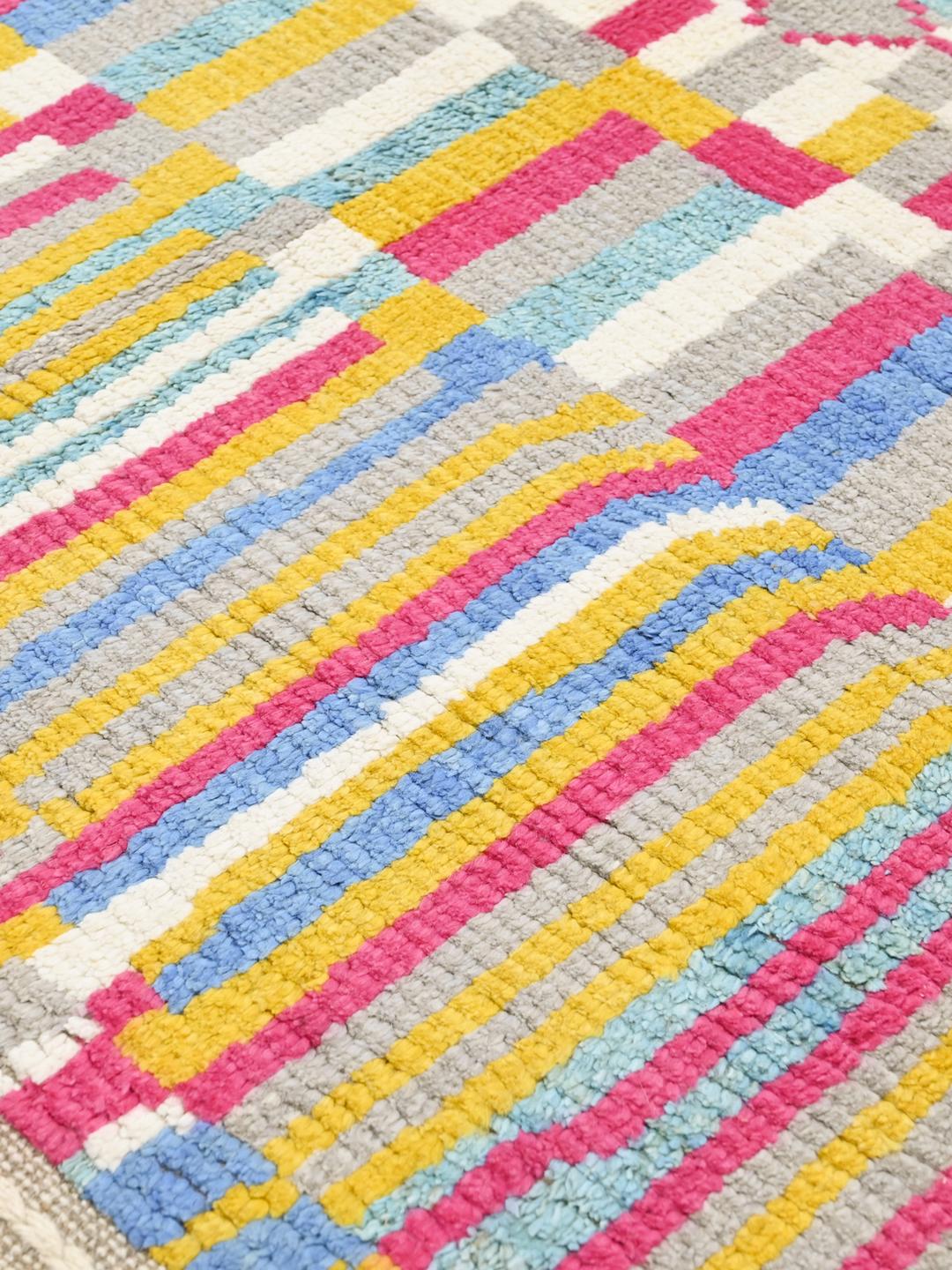 Handgeknoopt multicolor wollen vloerkleed uit Afghanistan met geometrische stammenpatronen