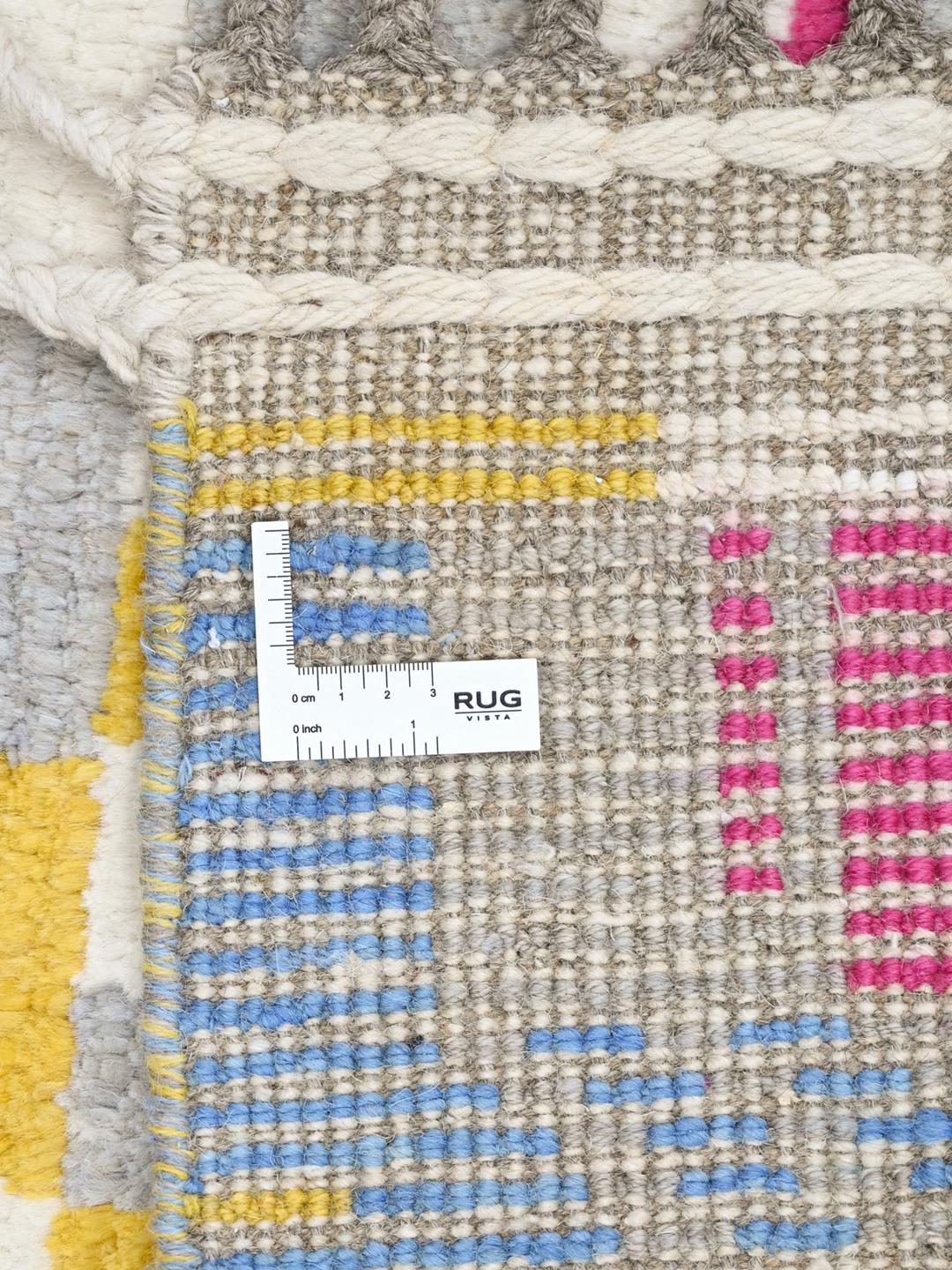 Handgeknoopt multicolor wollen vloerkleed uit Afghanistan met geometrische stammenpatronen