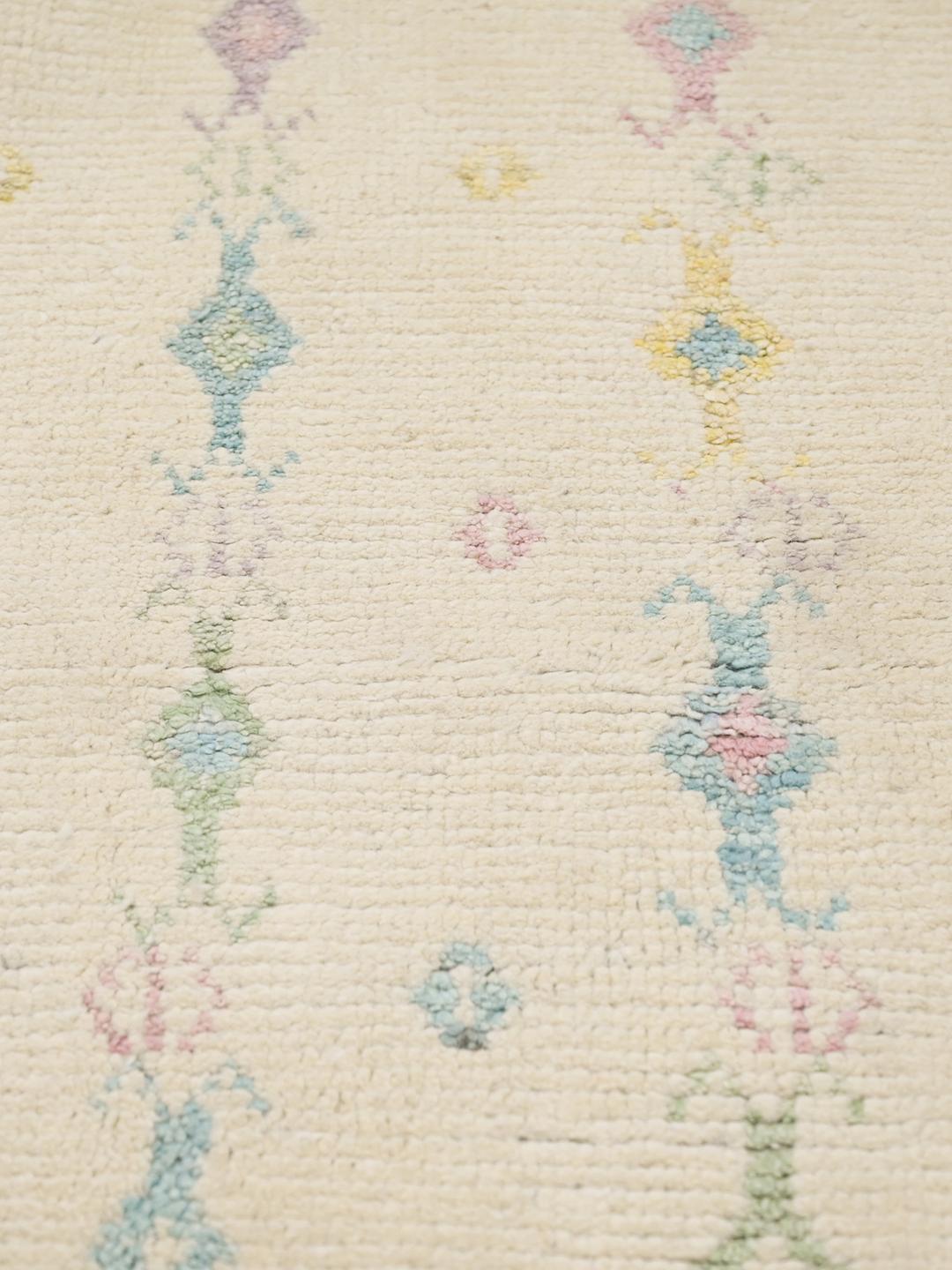Hand-knotted Afghan wool rug in beige with pastel tribal patterns