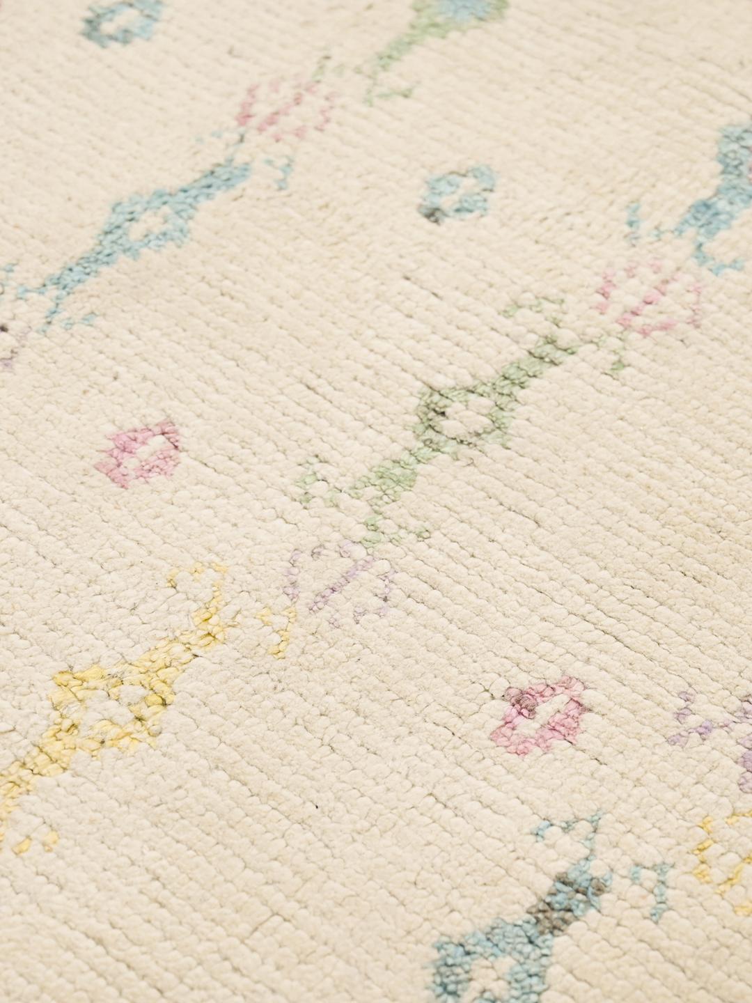 Hand-knotted Afghan wool rug in beige with pastel tribal patterns