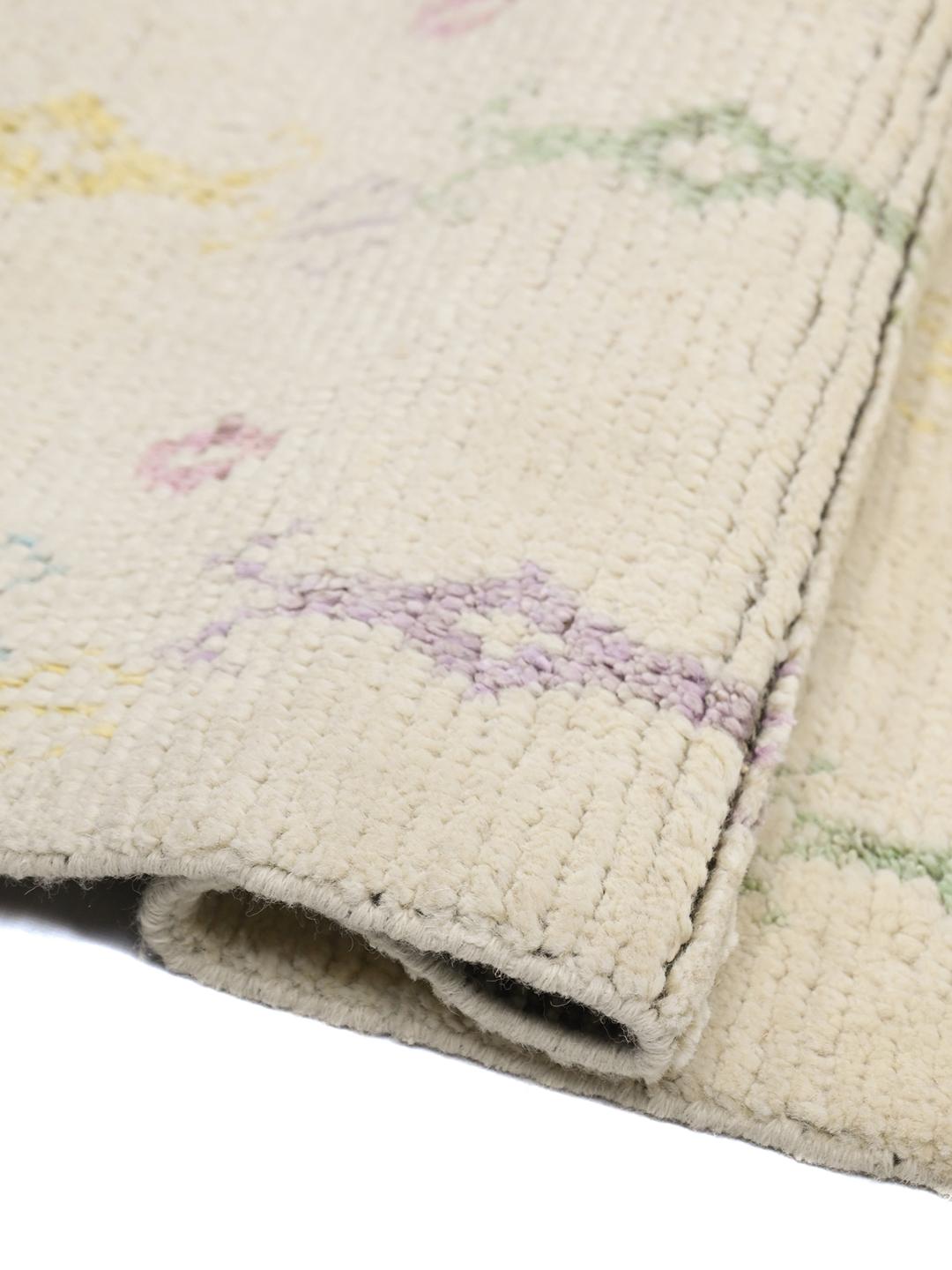 Hand-knotted Afghan wool rug in beige with pastel tribal patterns