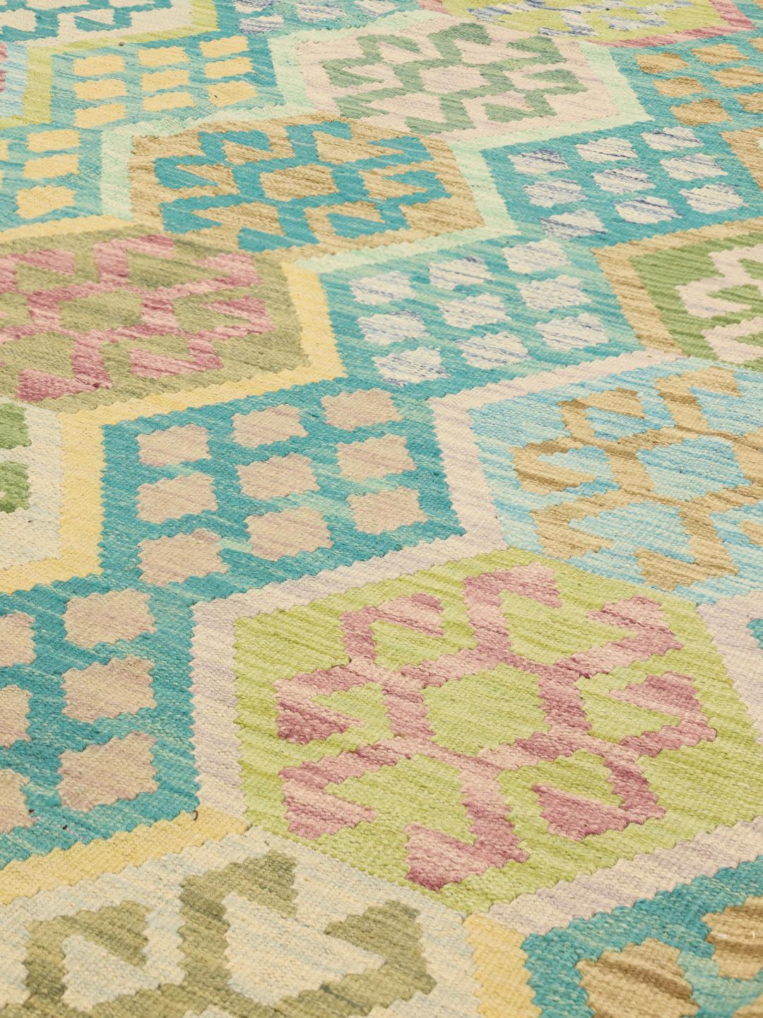 Hand-woven Afghan kelim rug featuring a vibrant multicolor geometric pattern