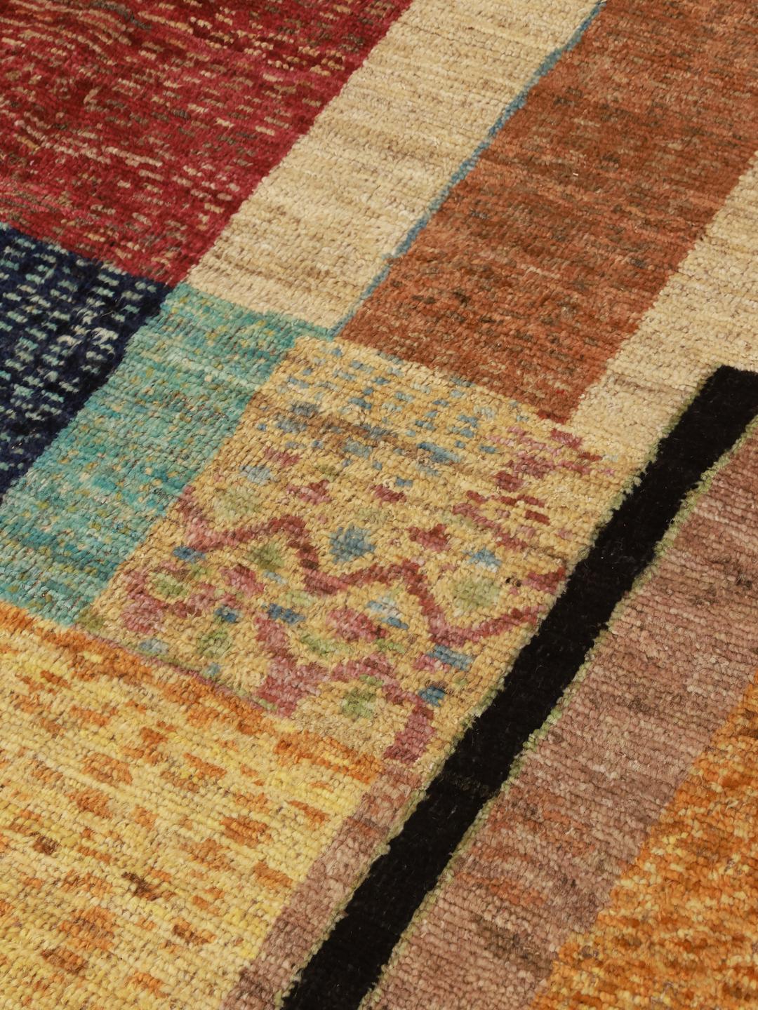 A large, one-of-a-kind multicolour Berber rug from Afghanistan with an abstract geometric pattern.