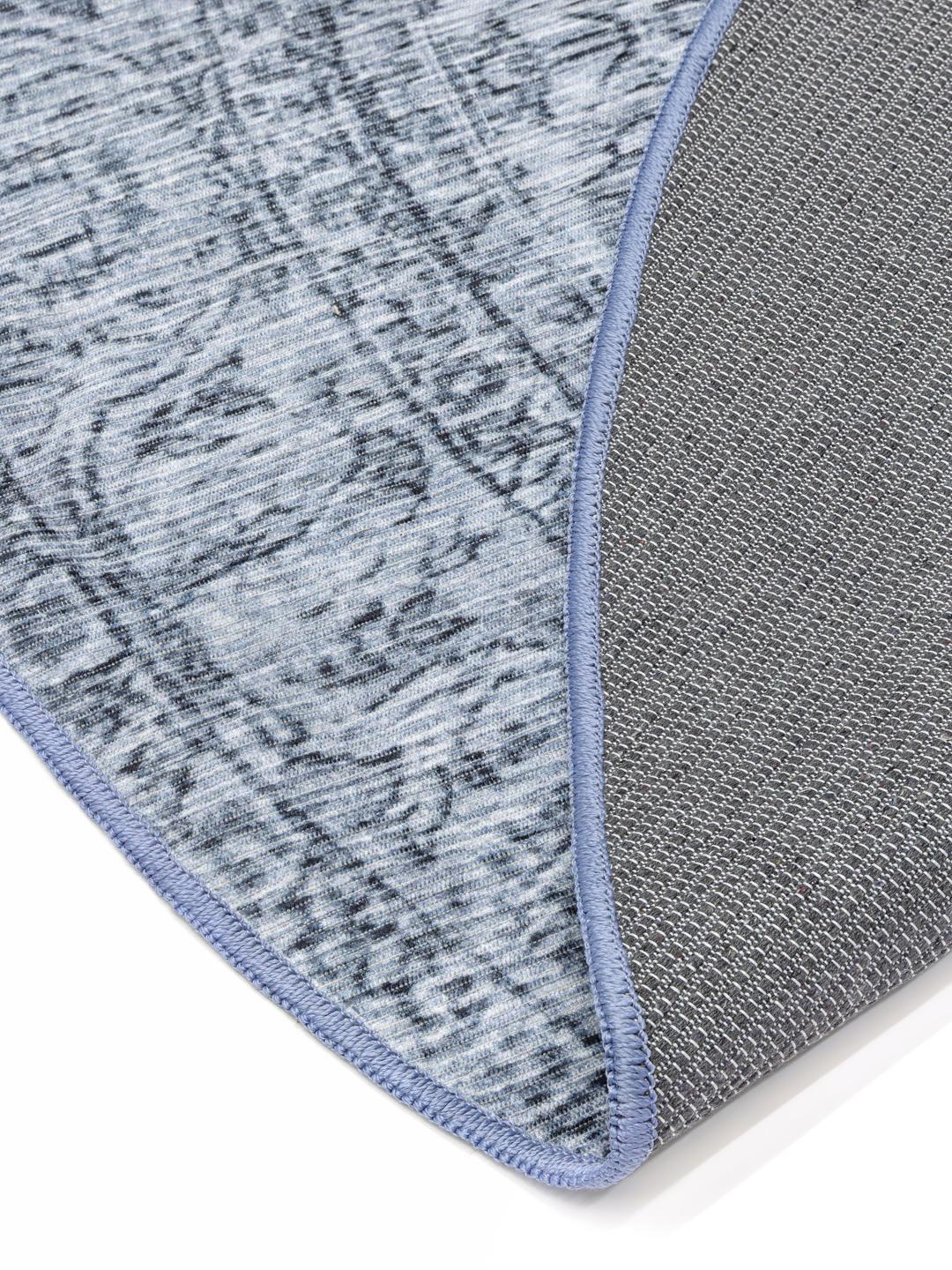 Rond blauw tapijt met medaillonpatroon