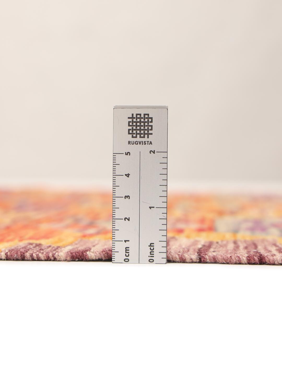 Hand-woven Afghan Kelim rug featuring vibrant geometric patterns in multicolor wool.