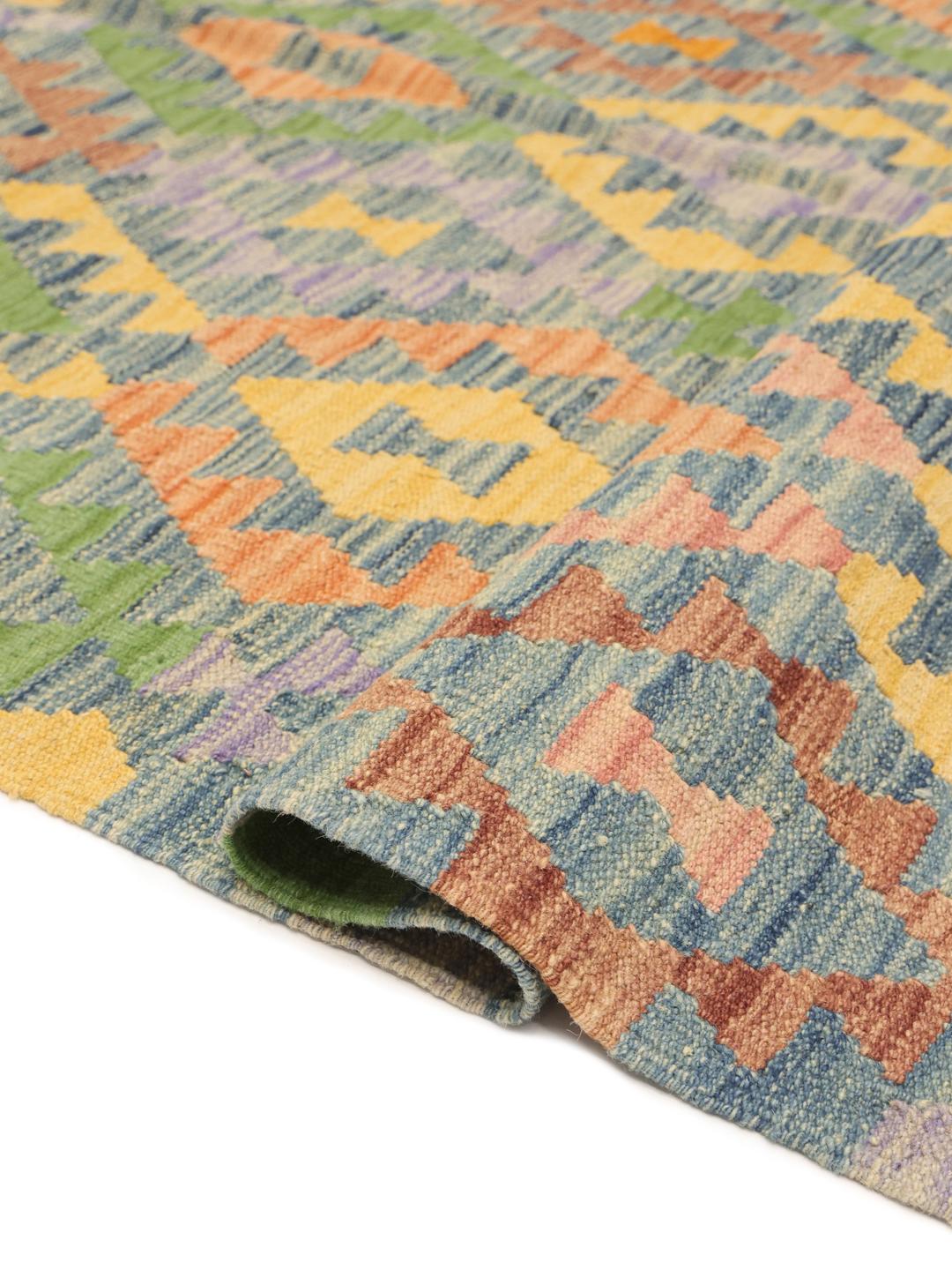 Hand-woven Afghan Kelim rug featuring a colourful geometric diamond pattern