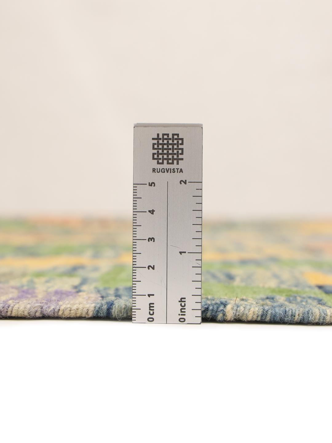Hand-woven Afghan Kelim rug featuring a colourful geometric diamond pattern