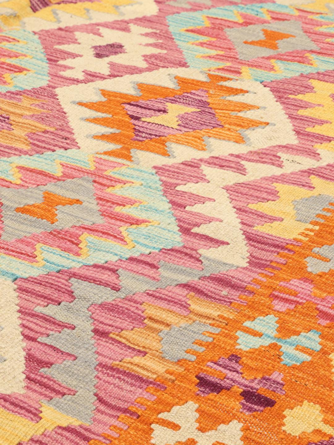 Hand-woven Afghan Kelim rug featuring a vibrant multicolor geometric pattern