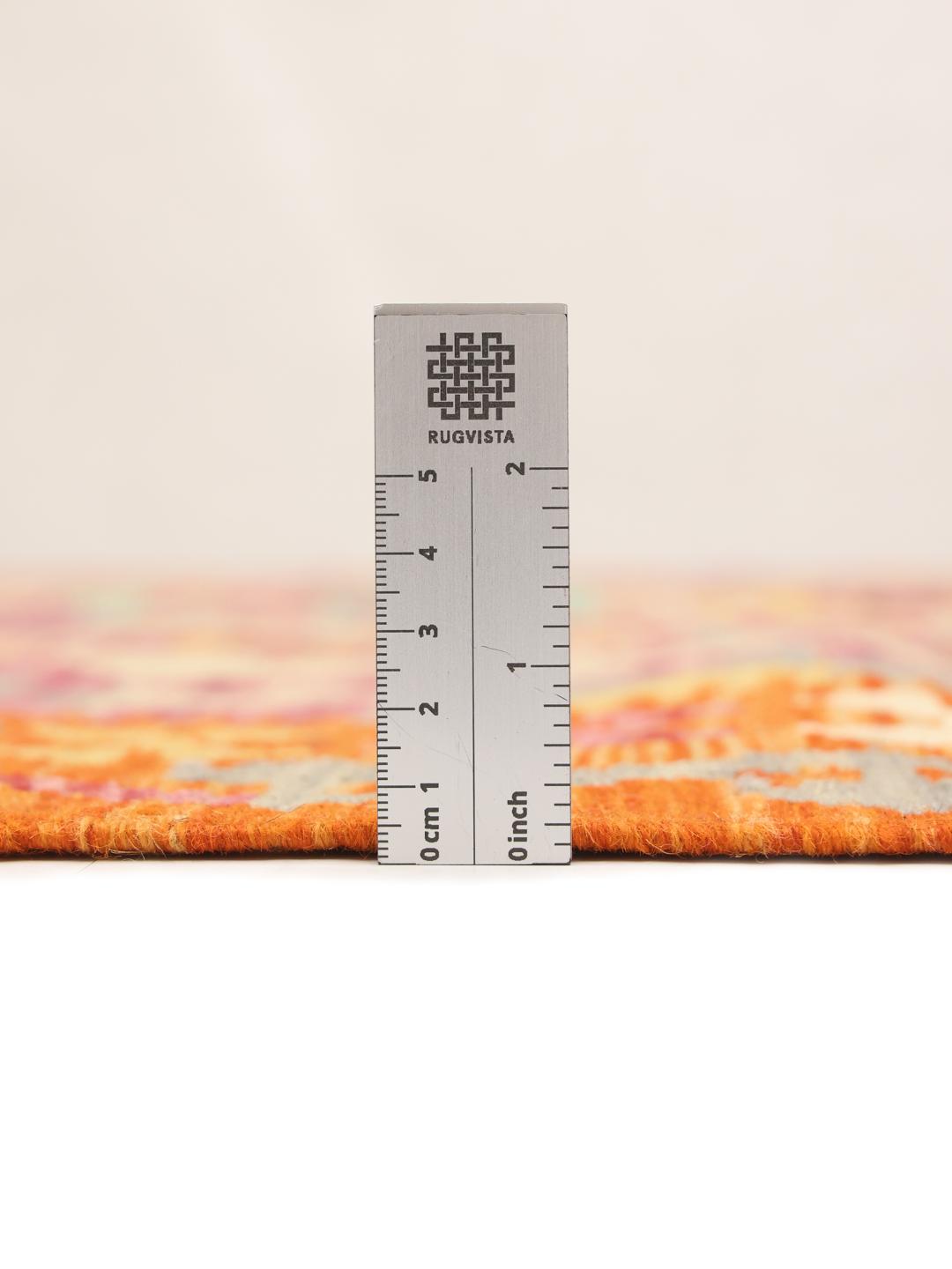 Hand-woven Afghan Kelim rug featuring a vibrant multicolor geometric pattern