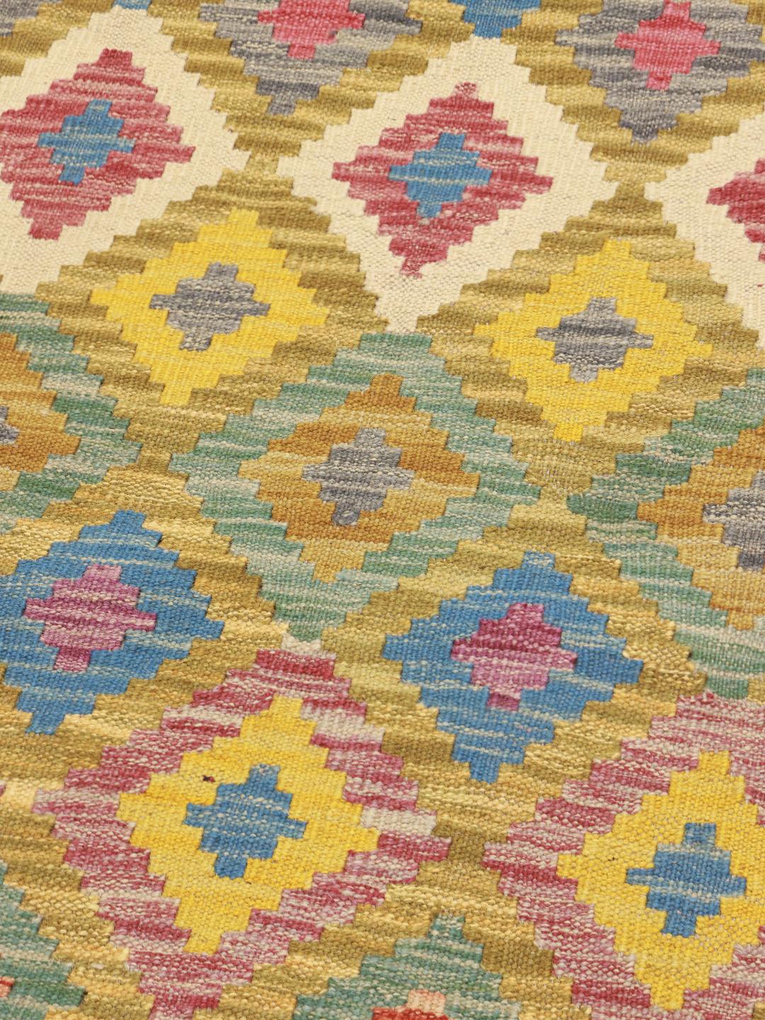 Hand-woven runner with a vibrant multicolor geometric diamond pattern