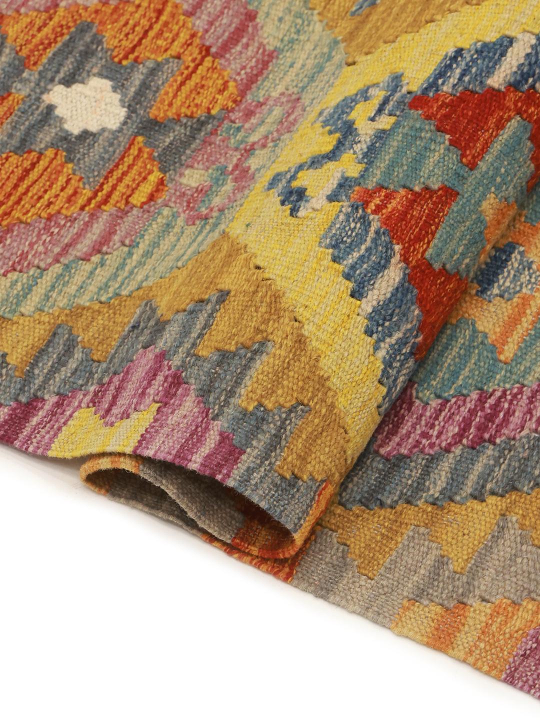 Hand-woven Kelim Afghan runner with geometric patterns in multicolor wool.