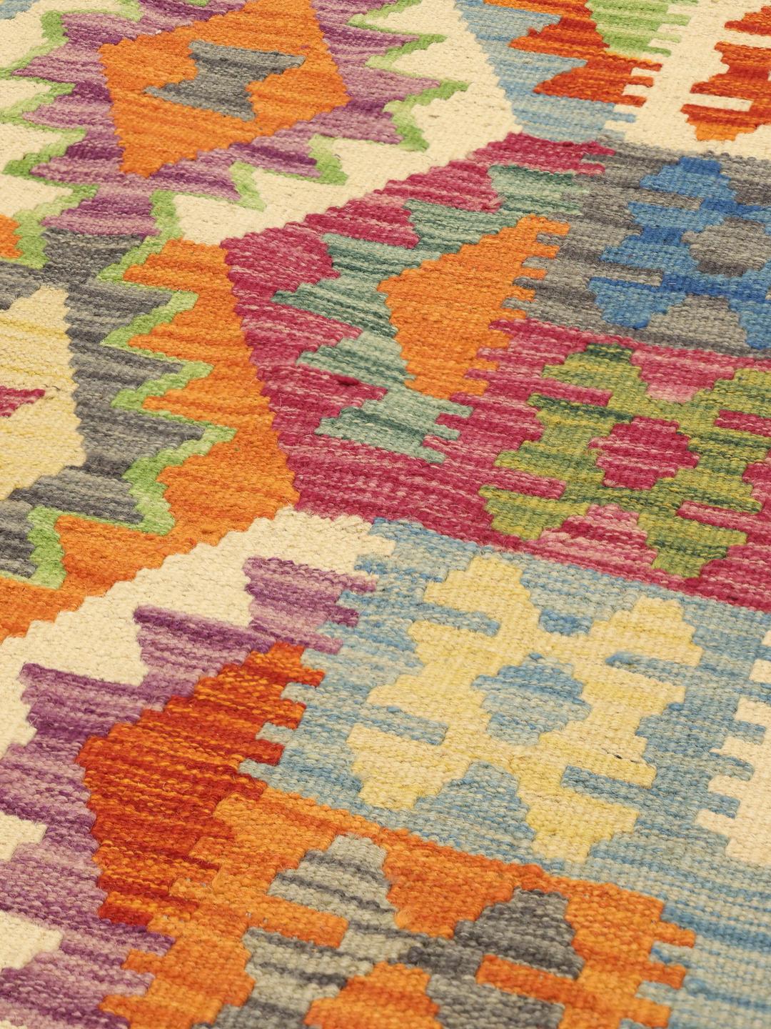Hand-woven Afghan runner with colourful geometric patterns